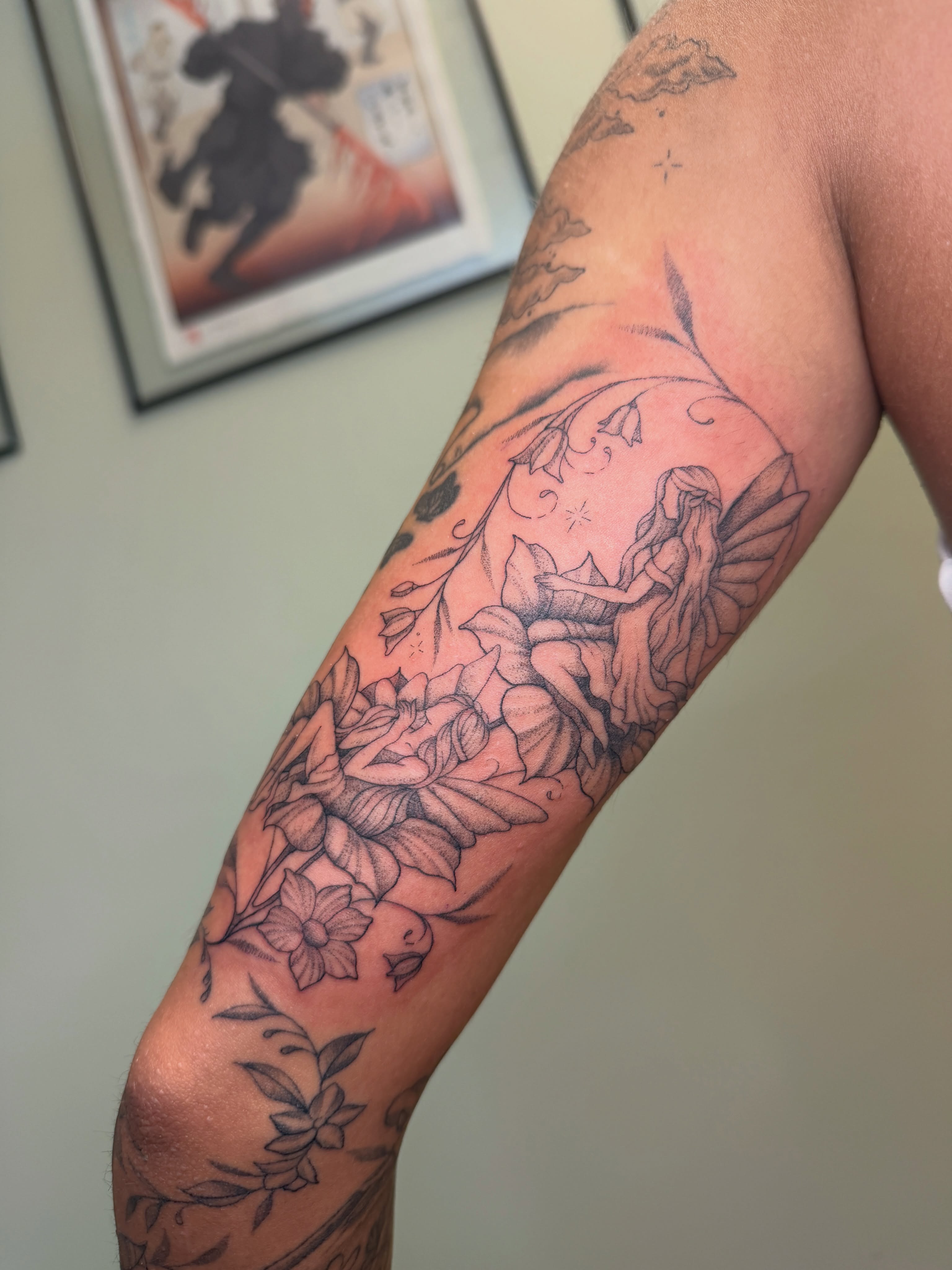 Flower fairy fine line tattoo on the forearm by Koryn Donnelly
