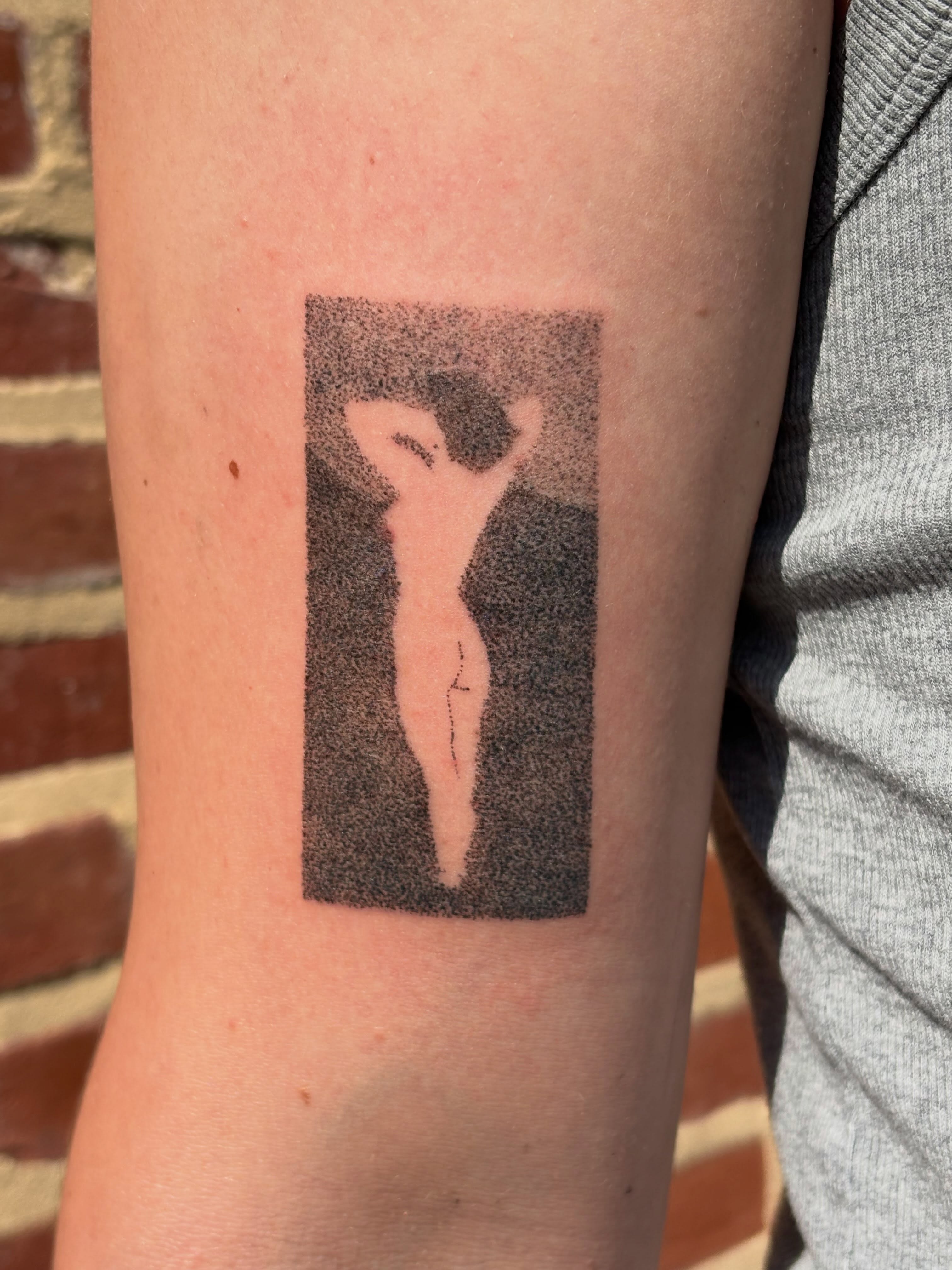Abstract figure dotwork tattoo on the forearm by Jill