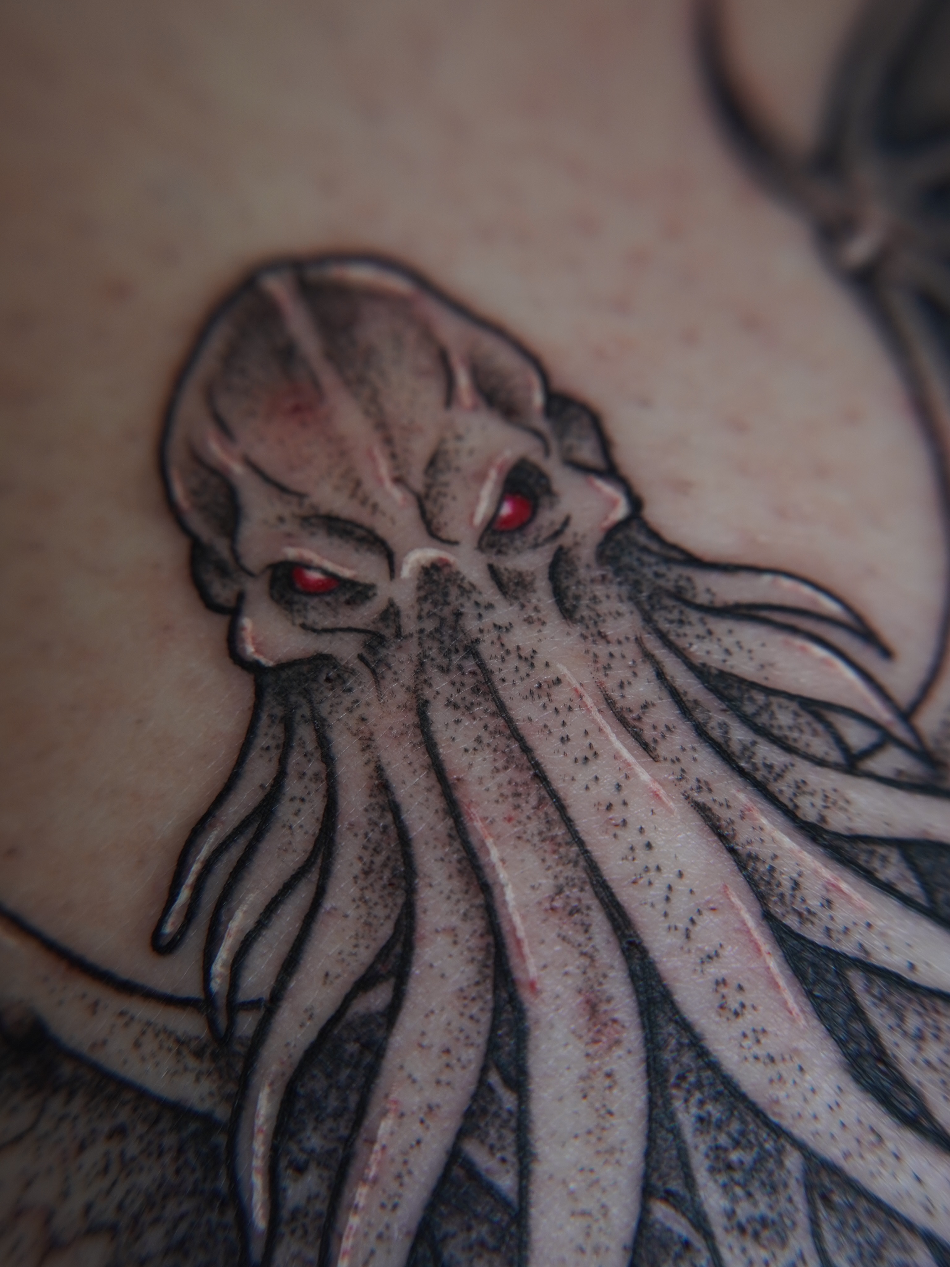 Cthulhu dotwork tattoo on the chest by Cory Perry-Servellon