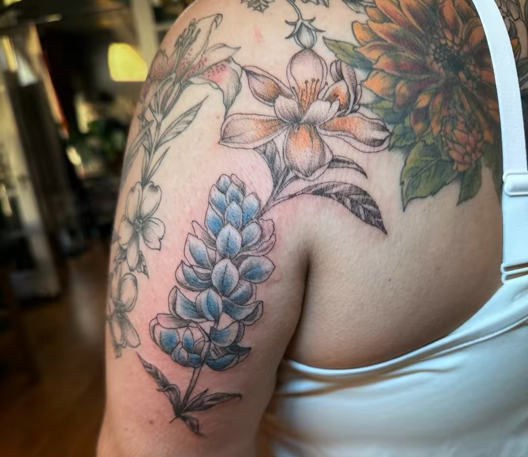 Floral arrangement realism tattoo on the shoulder by Cecilia Marie