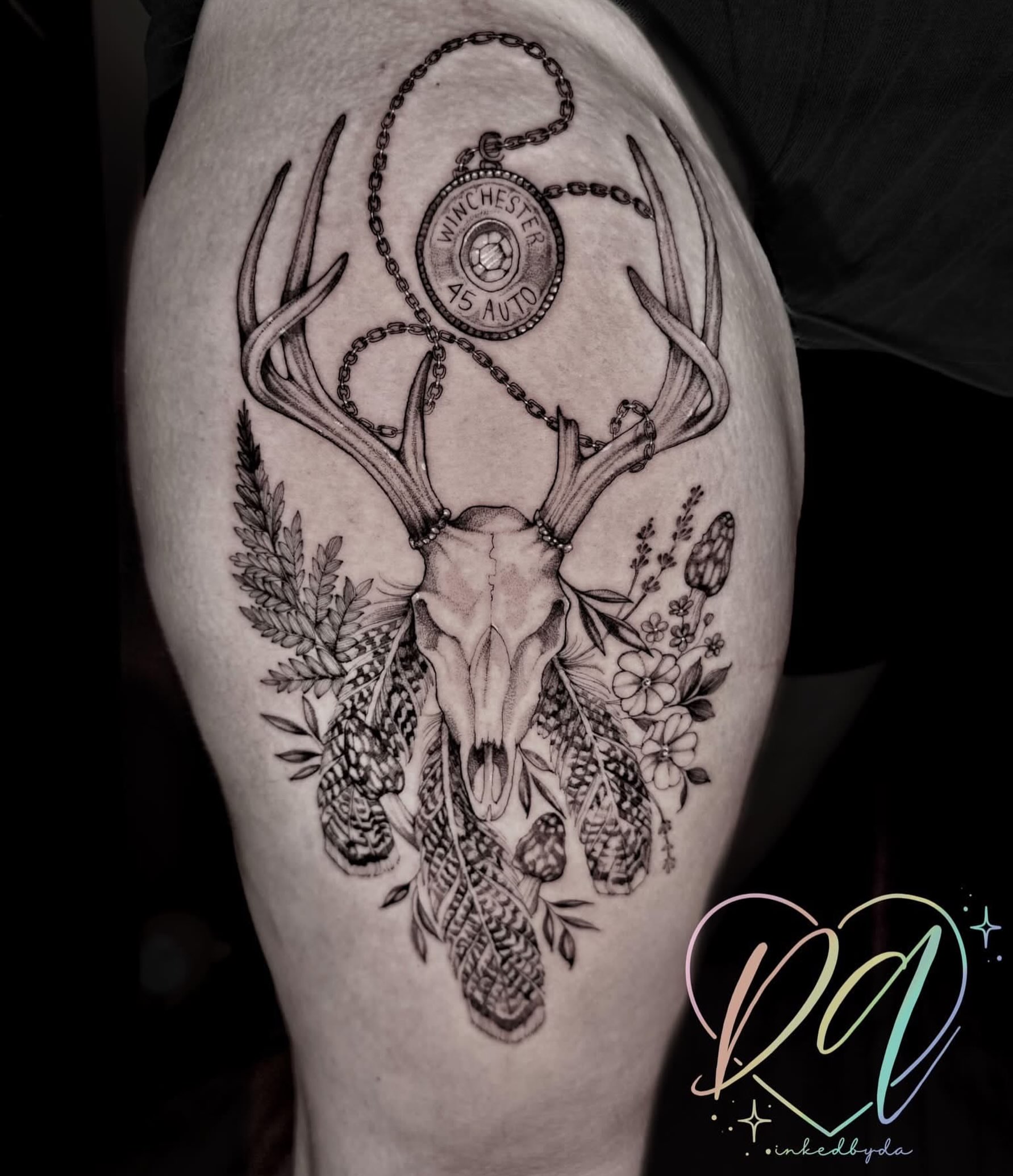 Deer skull with chain and flowers realism tattoo on the thigh by Dalton Alexandria