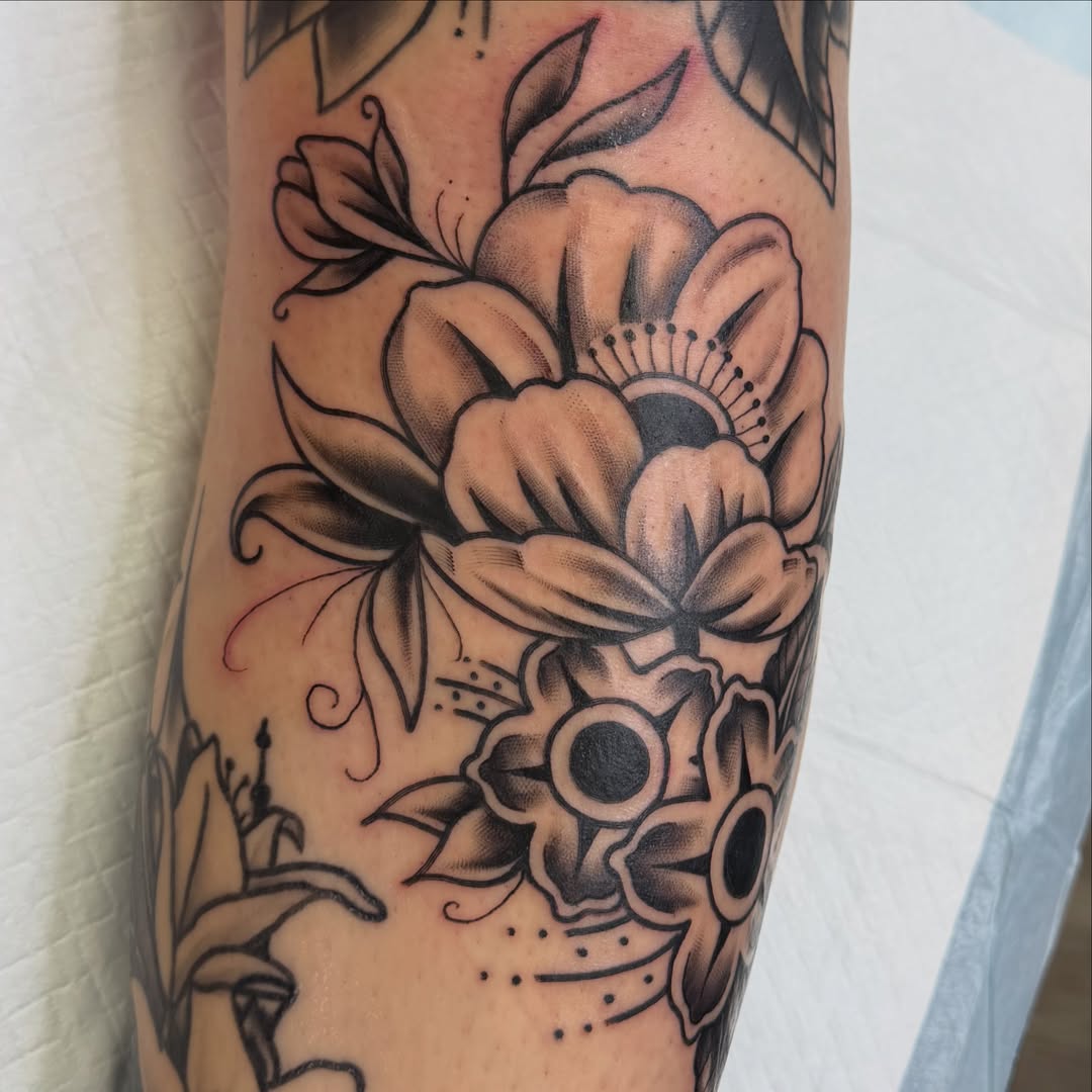Flower bouquet American traditional tattoo on the forearm by Amy Kolton