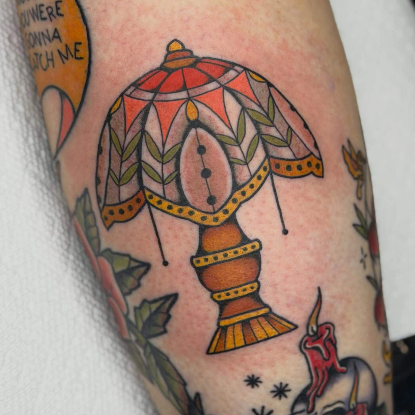 Lamp American traditional tattoo on the forearm by Jenna Szerszen-Wynn ๐