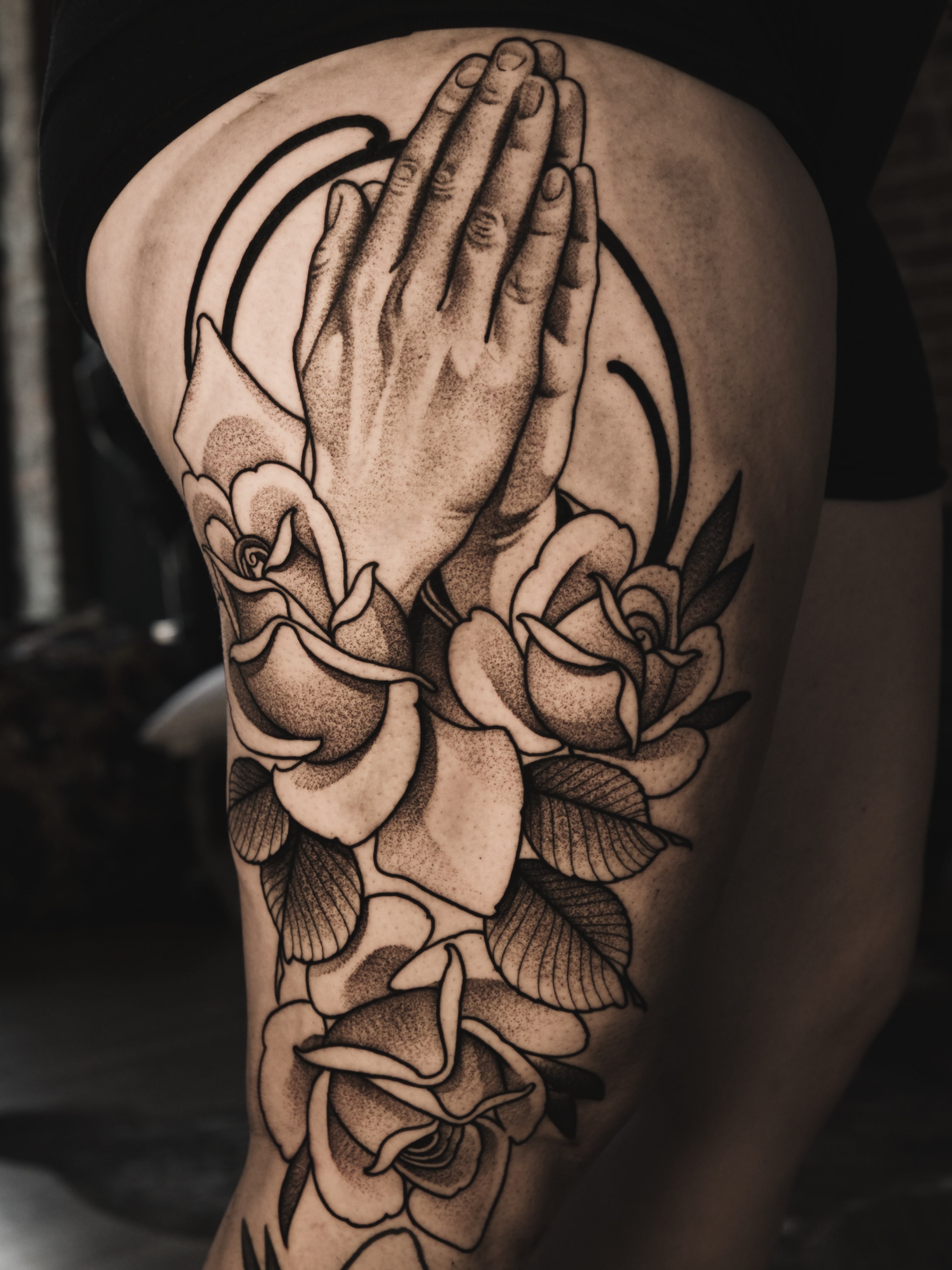 Praying hands with roses dotwork tattoo on the thigh by Craig St Peter, Kansas City, Missouri