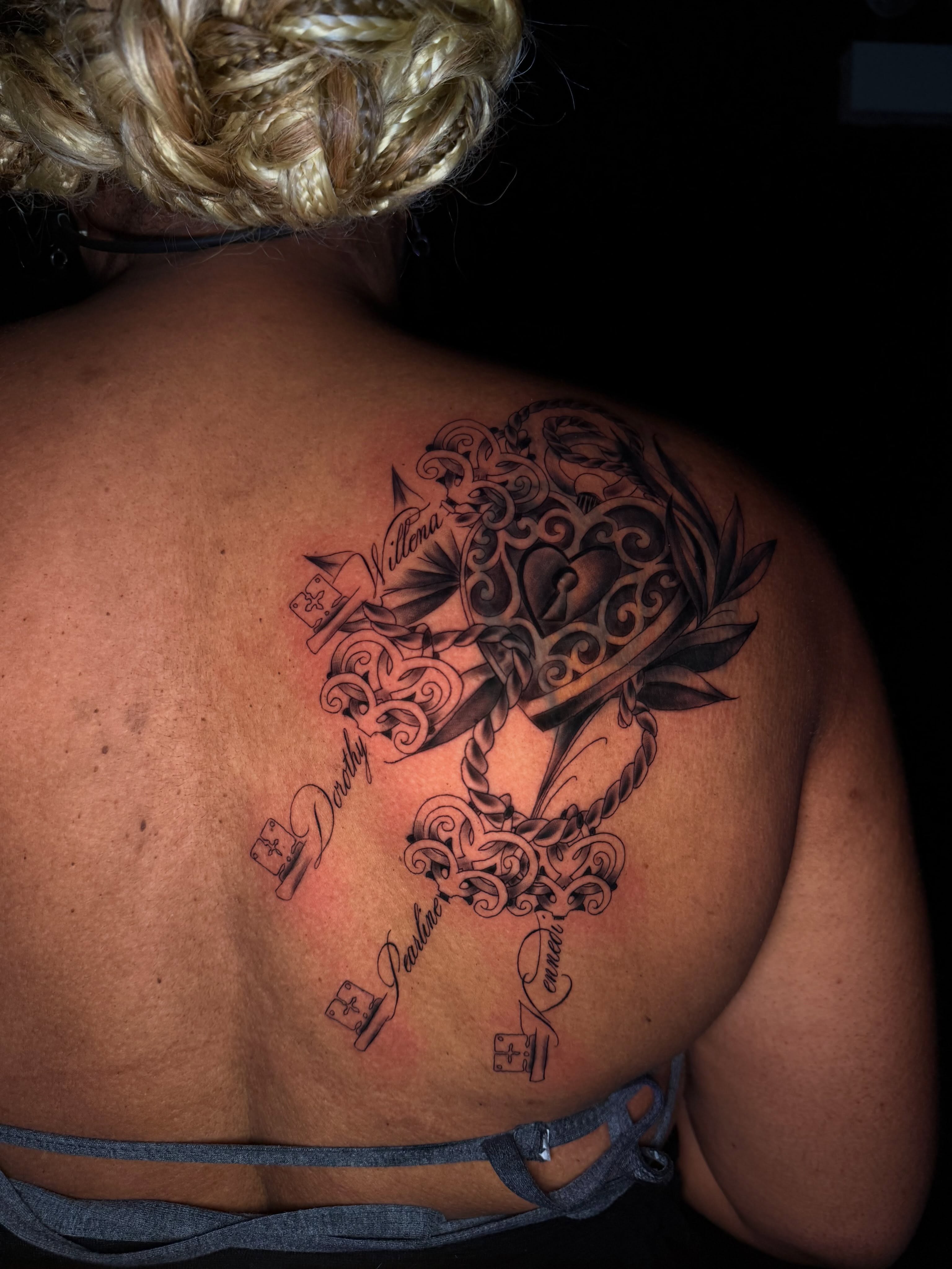 Heart and key black and grey tattoo on the back by Chicago Tattoo Artist