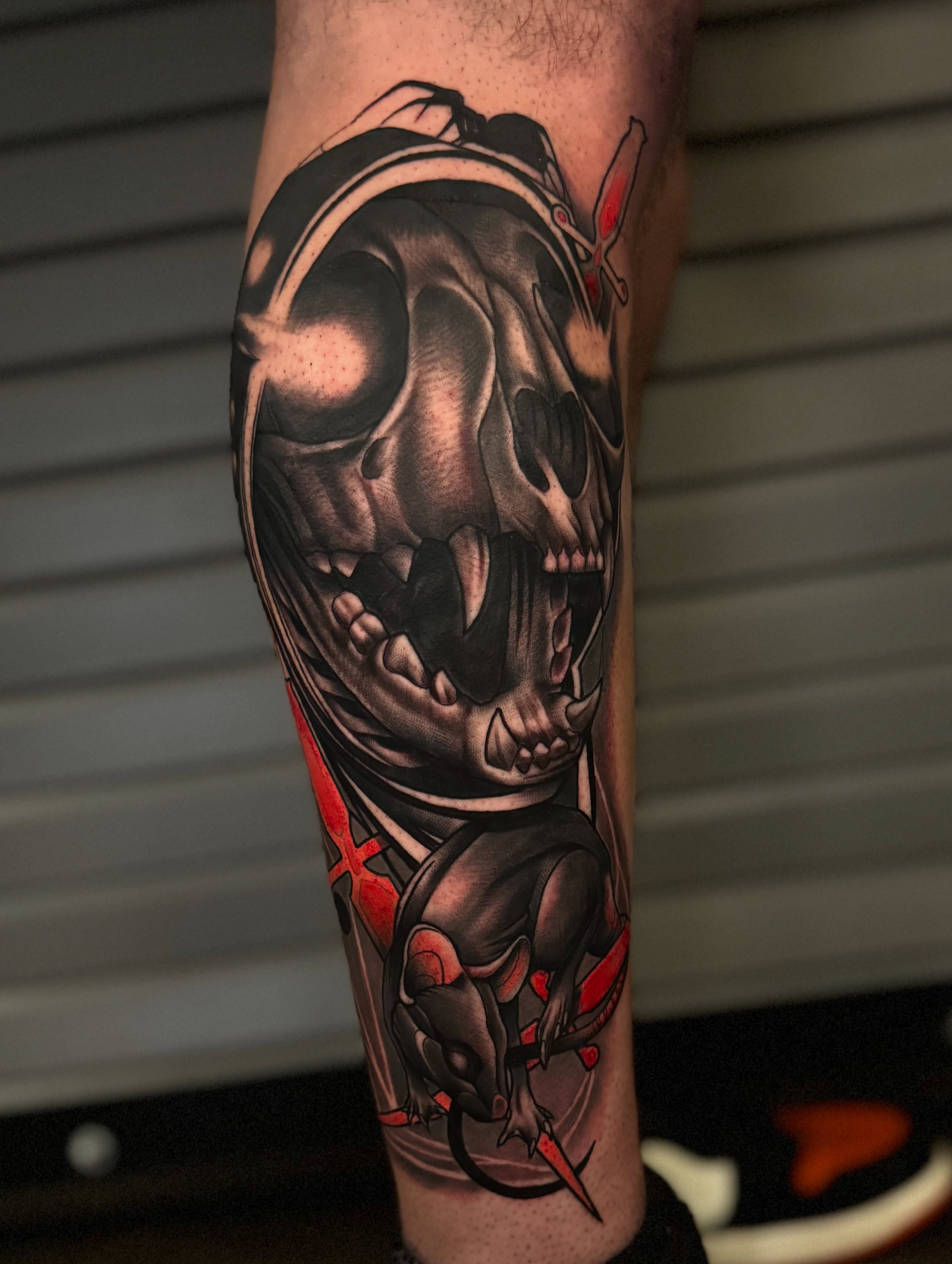Skull and demon dark realism tattoo on the forearm by Jaxx Kesler