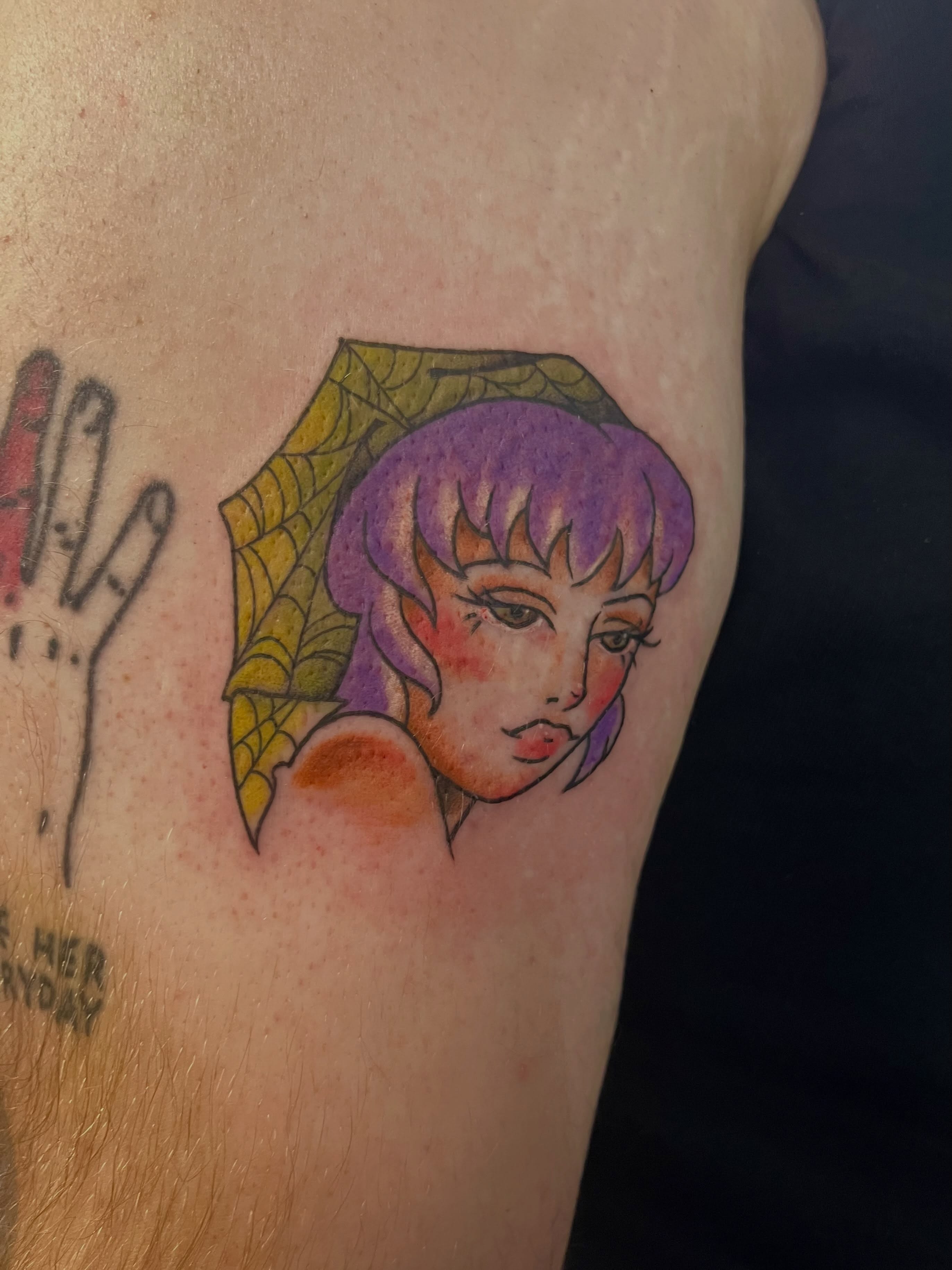 Woman with purple hair anime tattoo on the shoulder by Hannah Hahn