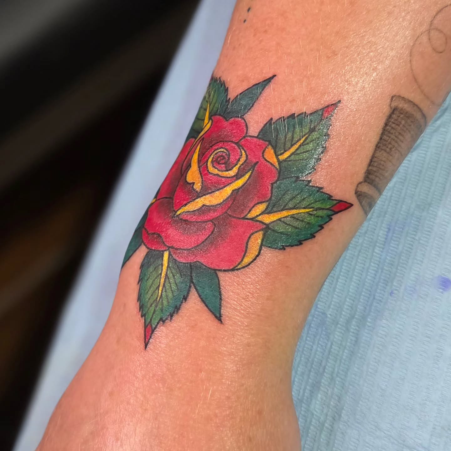 Red rose American traditional tattoo on the forearm by Jam ⚡️🐉🖤