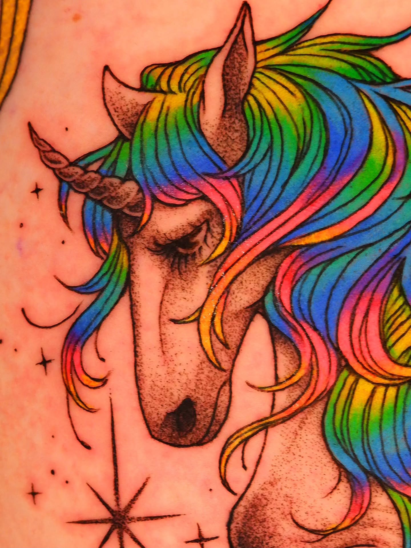 Rainbow unicorn dotwork tattoo on the upper arm by bird ✦ tattoo artist ✦ philadelphia