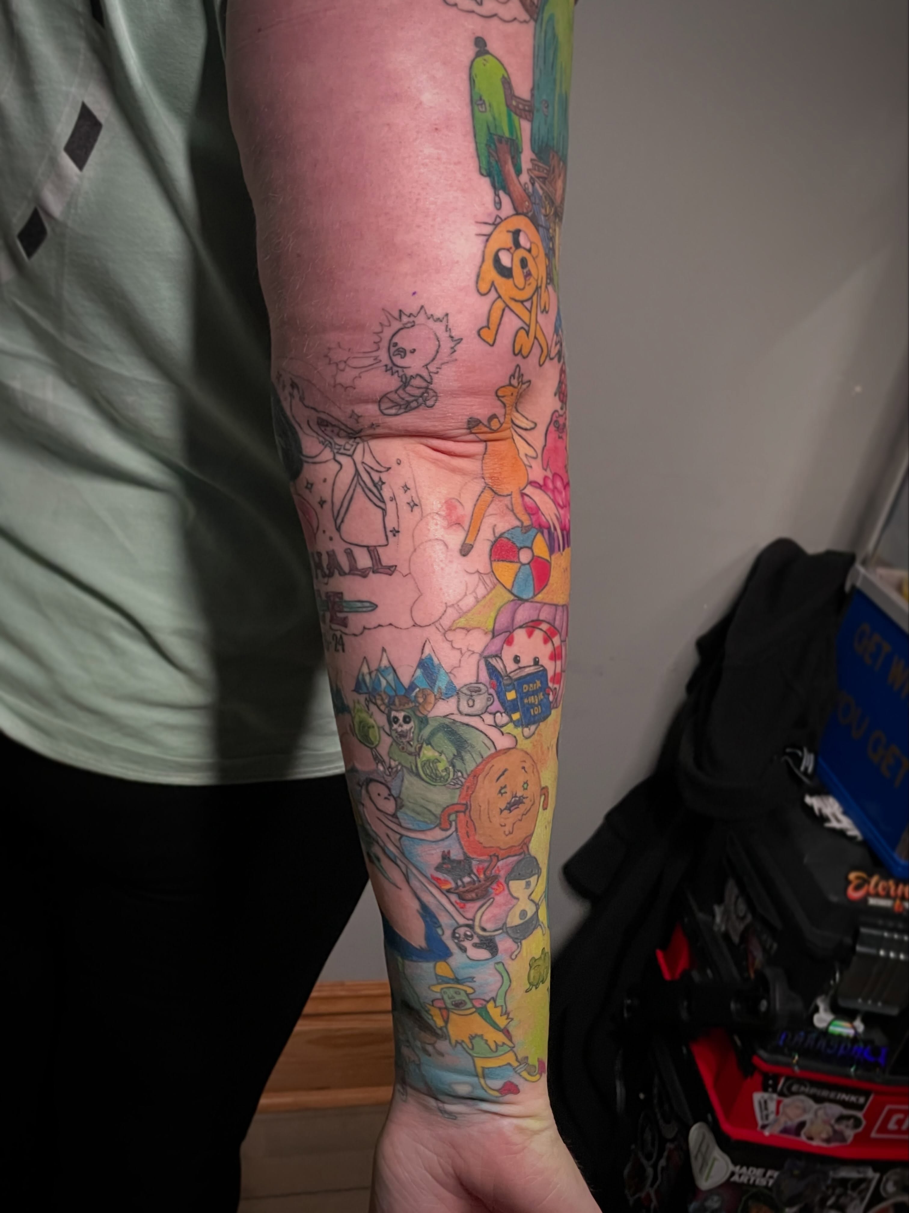 Adventure Time characters dotwork tattoo on the forearm by Hannah Copeskey