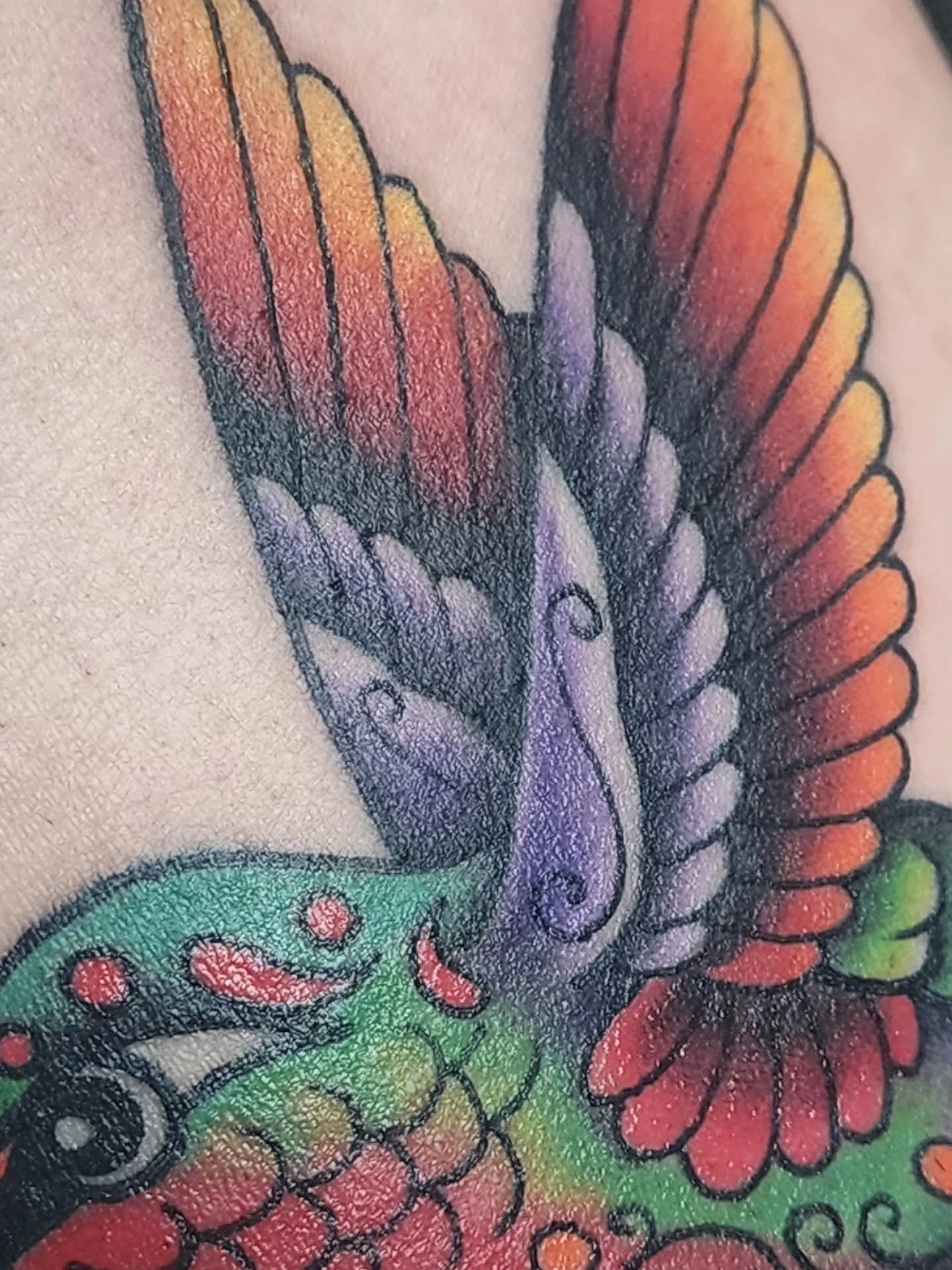 Bird American traditional tattoo on the upper arm by Meggalodon 🖤 (Meggan Rose)