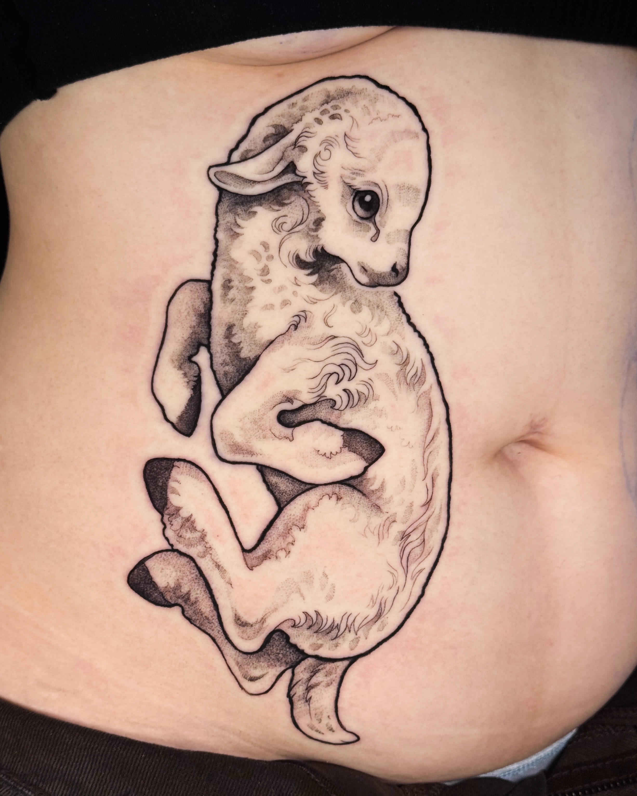 Lamb black and grey tattoo on the torso by Yasemin πΉπ·π¬π§ San Jose based tattoo artist
