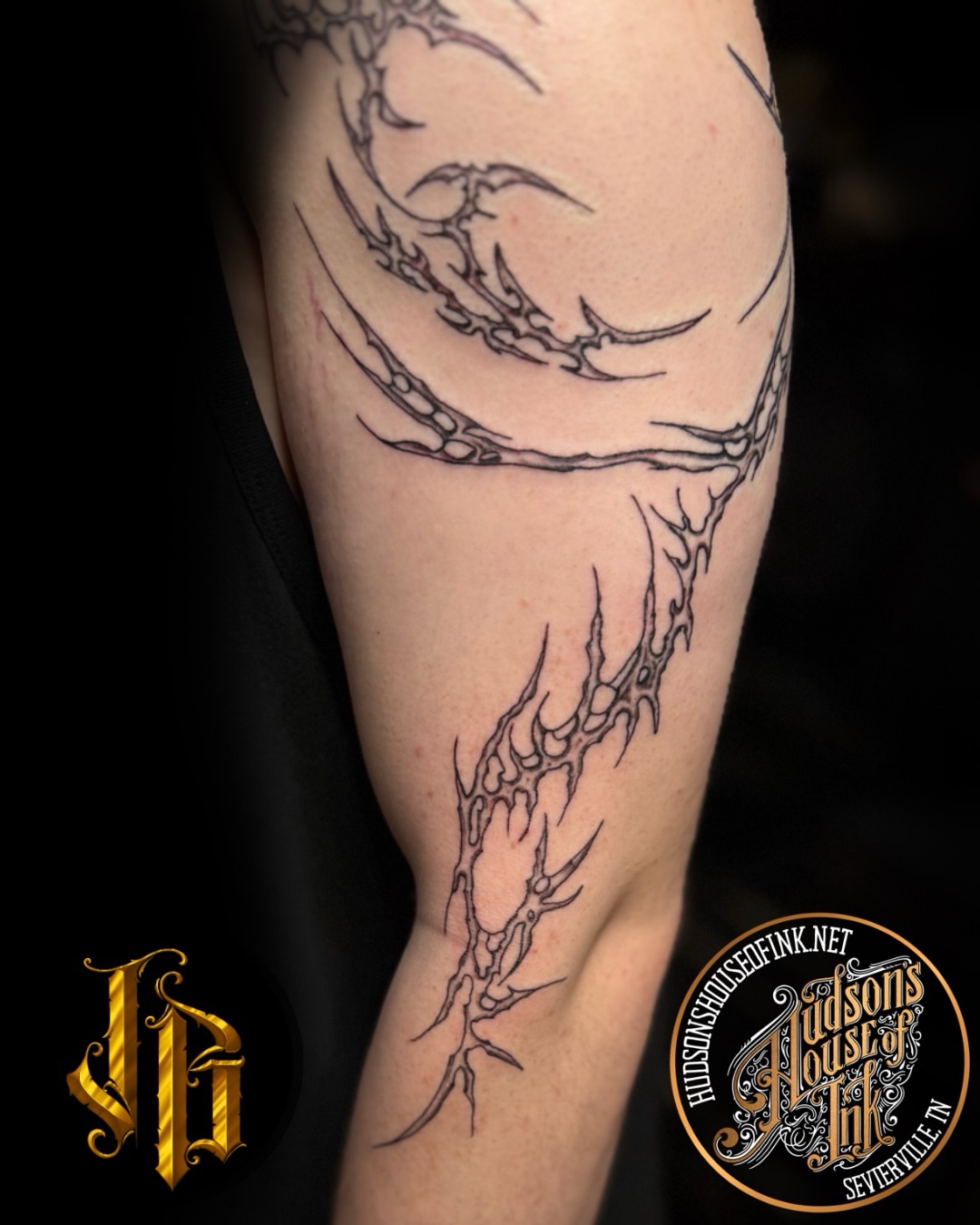 Clawed hand black and grey tattoo on the forearm by James Brooks