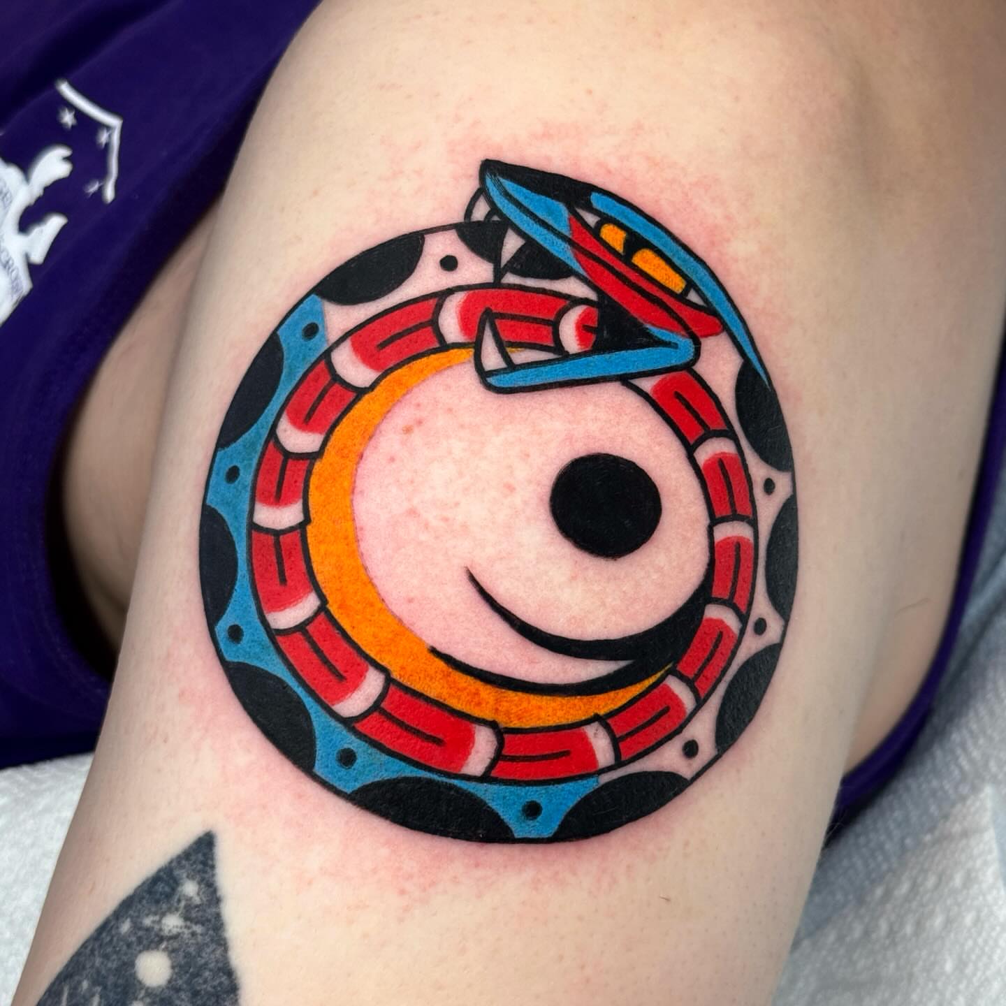 Mechanical gear geometric tattoo on the thigh by Jess Baker