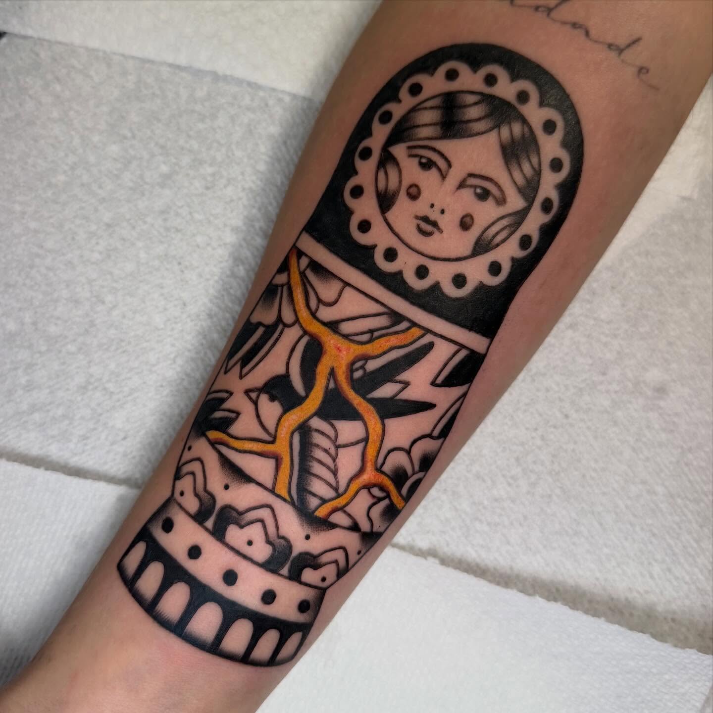 Doll American traditional tattoo on the forearm by charlie