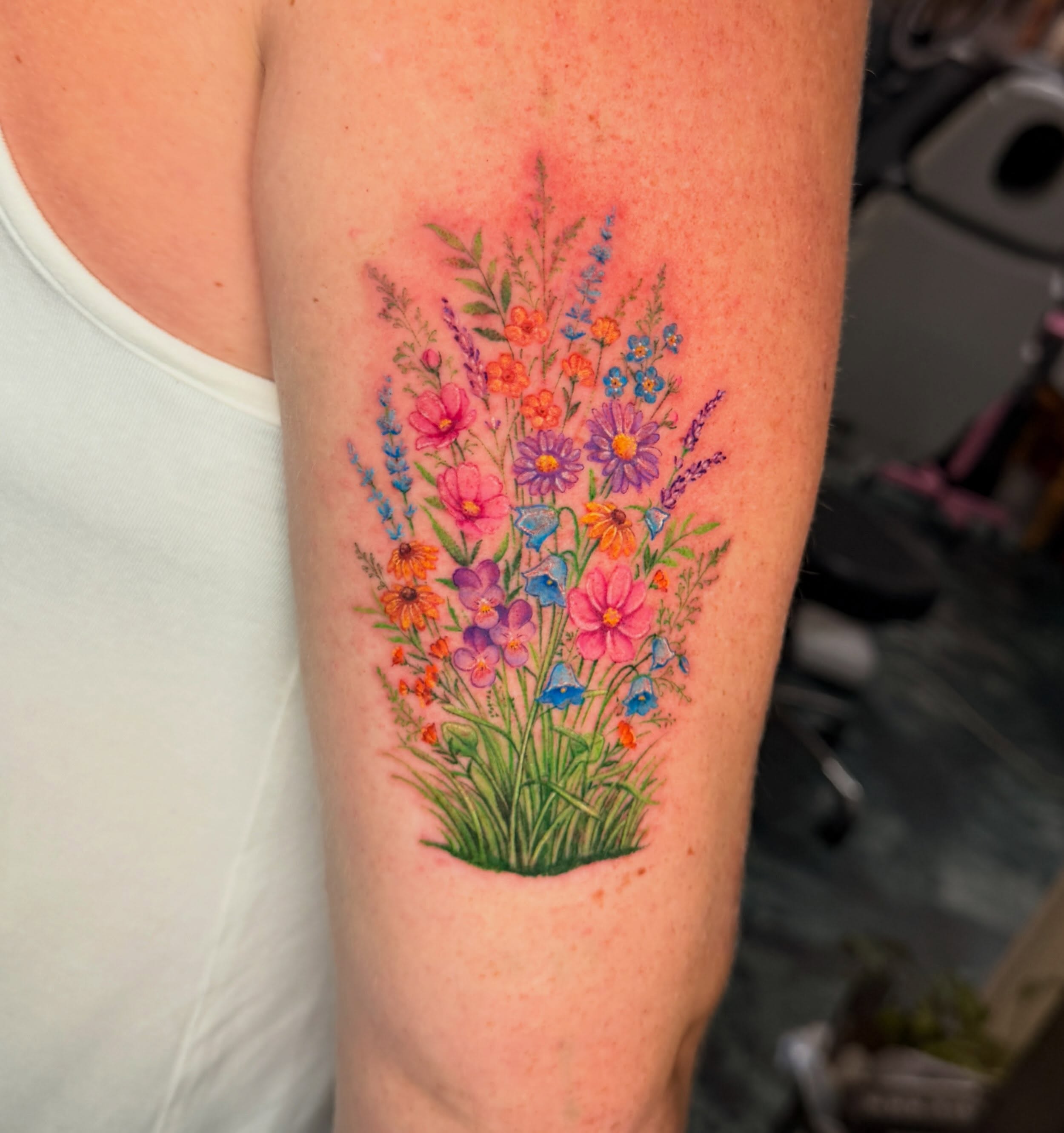 Flower bouquet watercolor tattoo on the forearm by Violet Michelle Williams, Charlotte, North Carolina