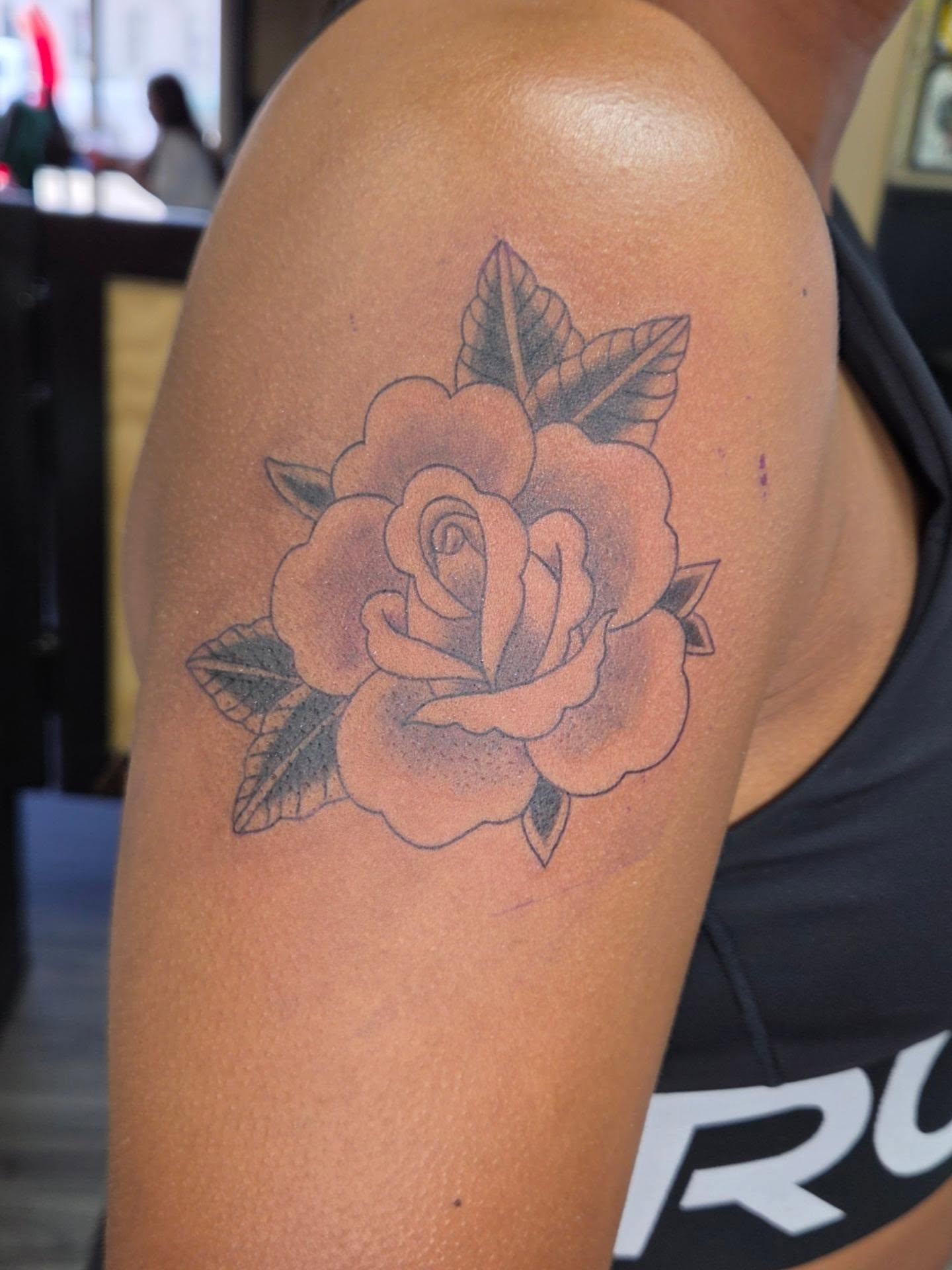 Rose American traditional tattoo on the shoulder by Jessica Duggan
