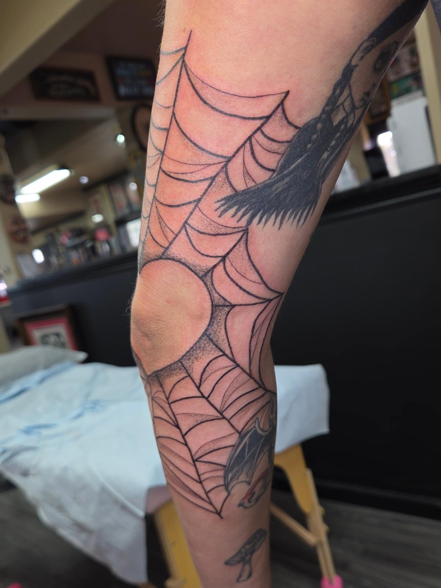 Spider web dotwork tattoo on the forearm by Jessica Duggan