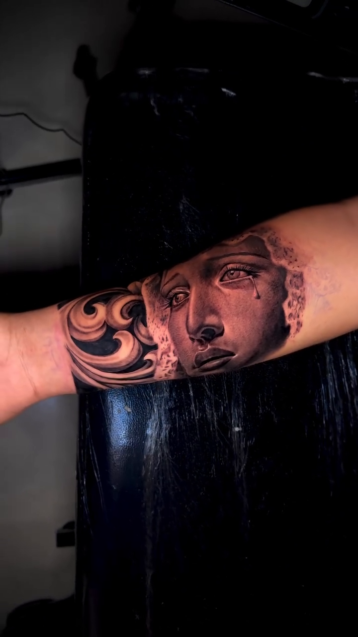 Bust of a classical figure realism tattoo by Brandon Patino