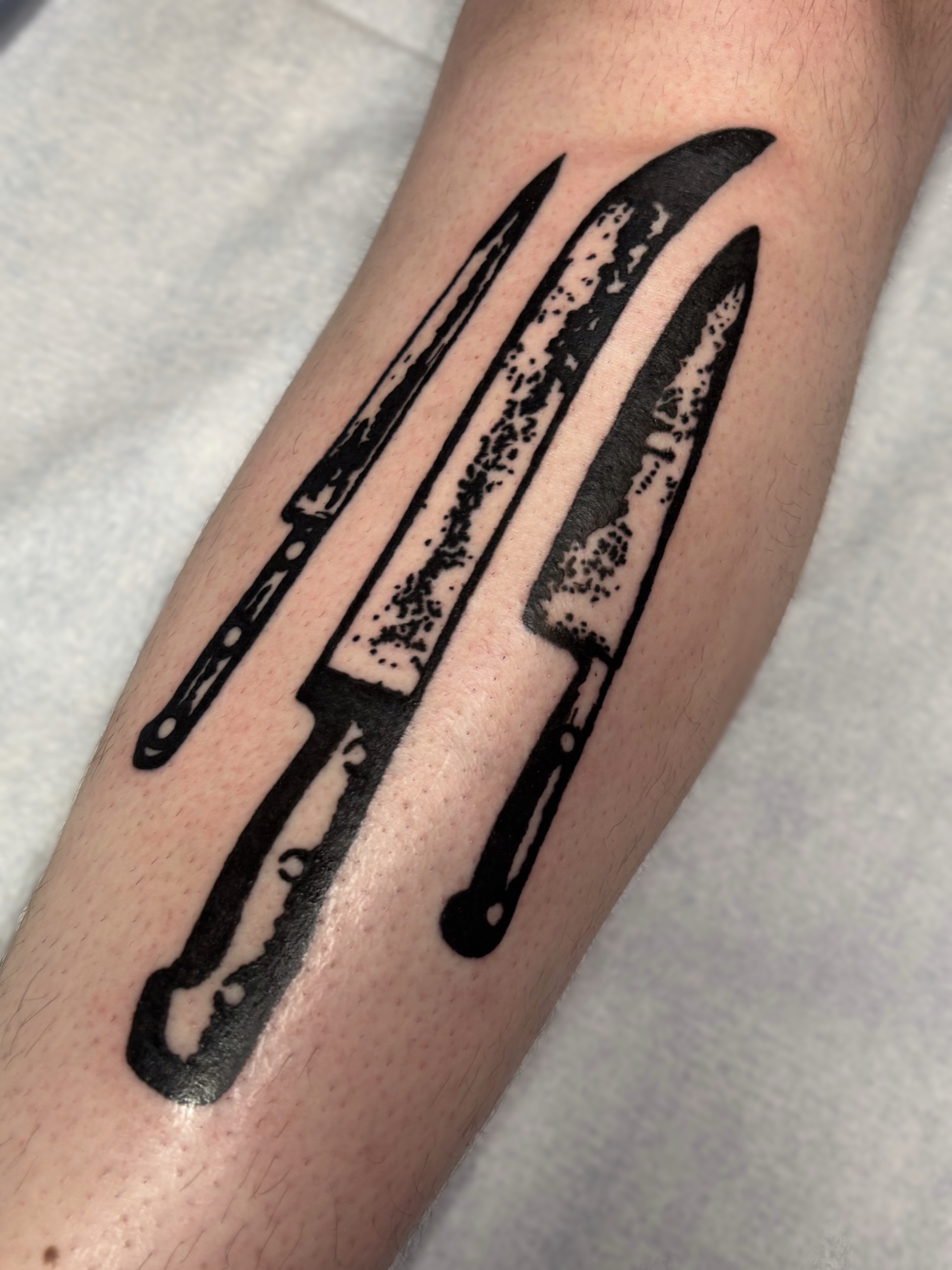 Knives dotwork tattoo on the forearm by Cooper, Portland, Oregon