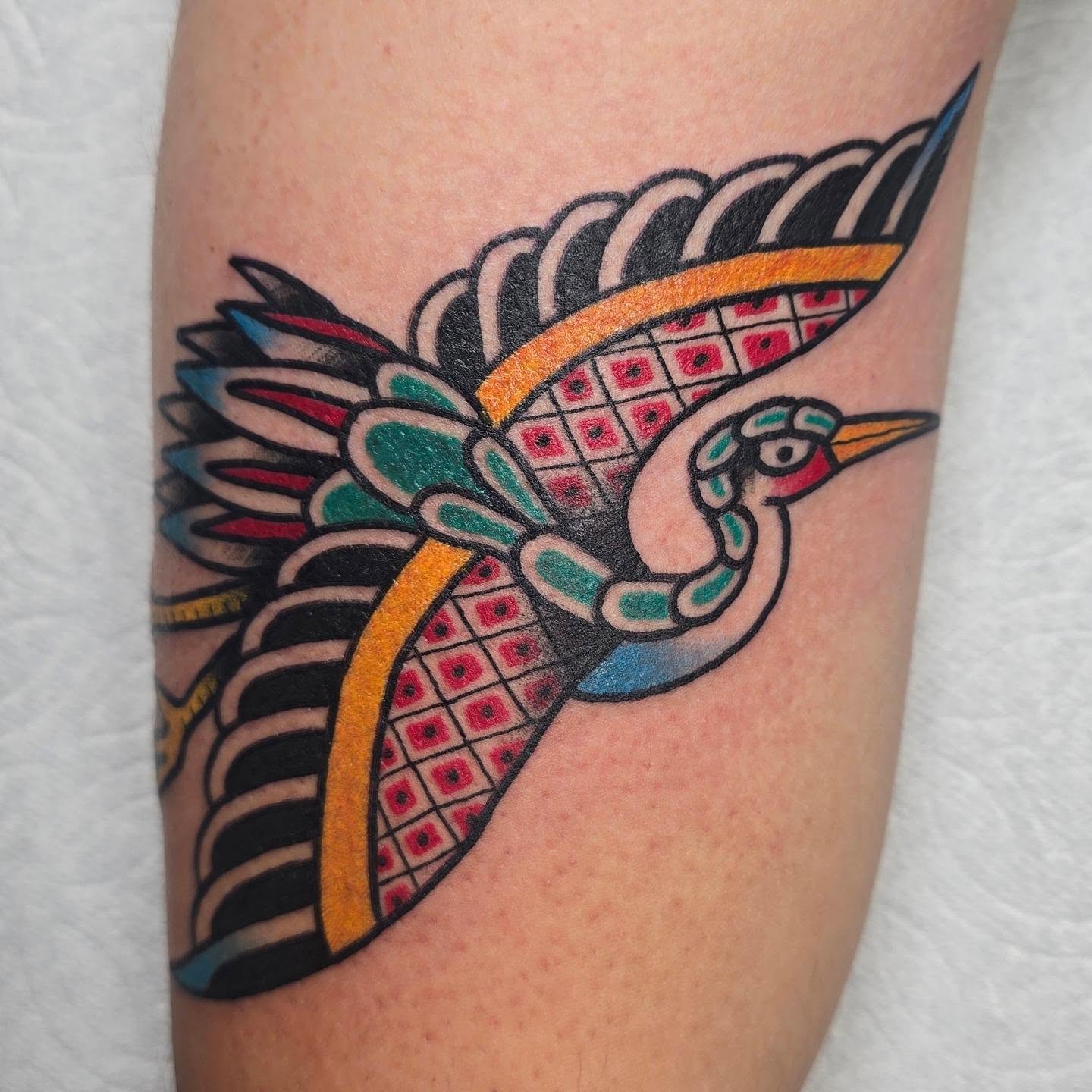 Bird American traditional tattoo on the forearm by A. Teixeira, Los Angeles, California