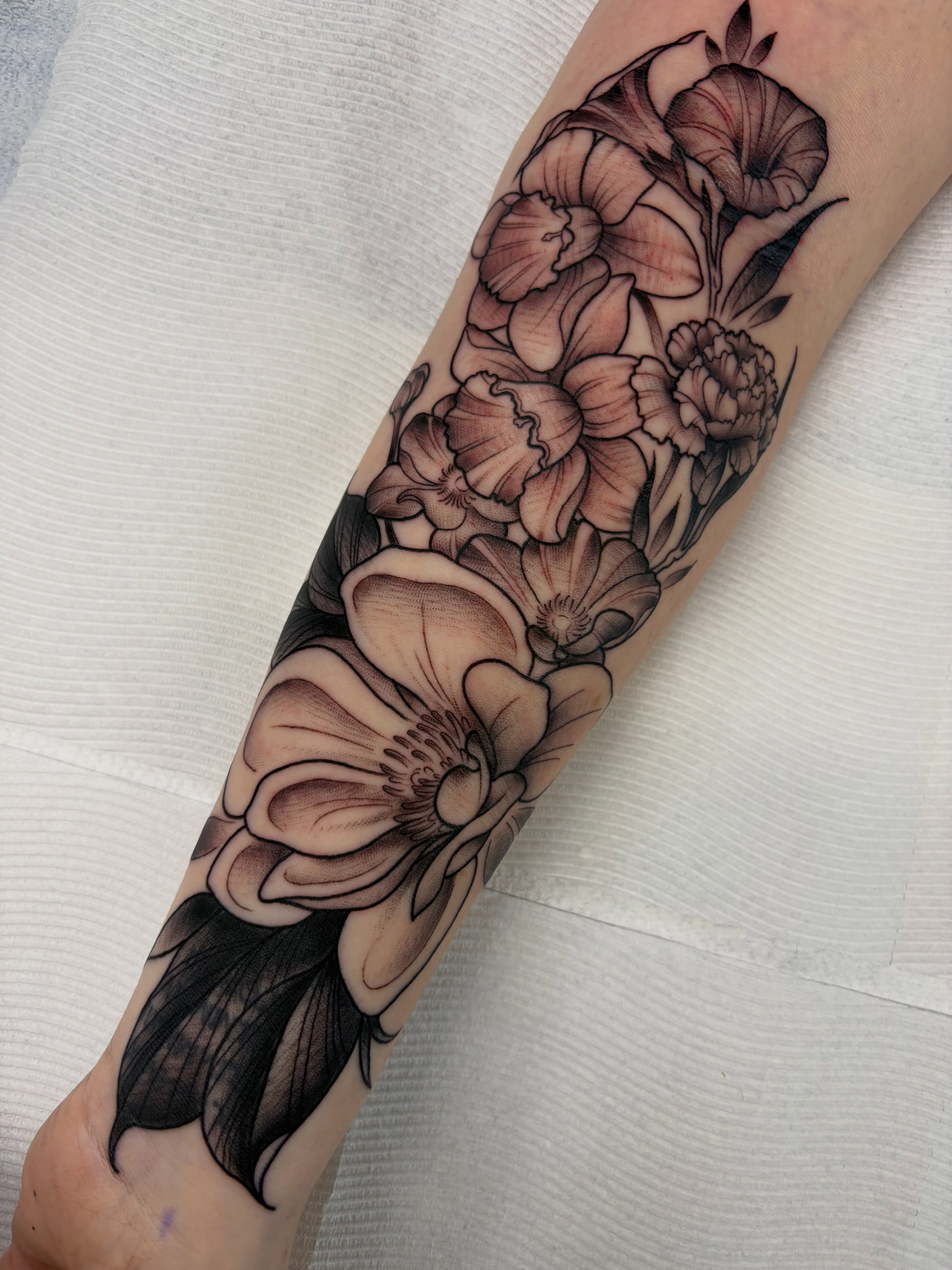 Flowers black and grey tattoo on the forearm by Kayla Fay, Baton Rouge, Louisiana
