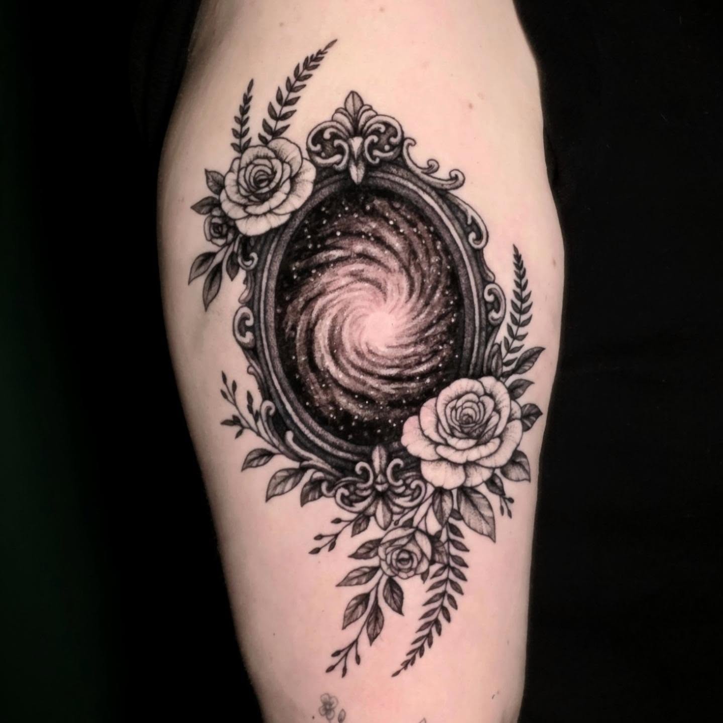 Galaxy in mirror geometric tattoo on the forearm by Nick de Hoyos