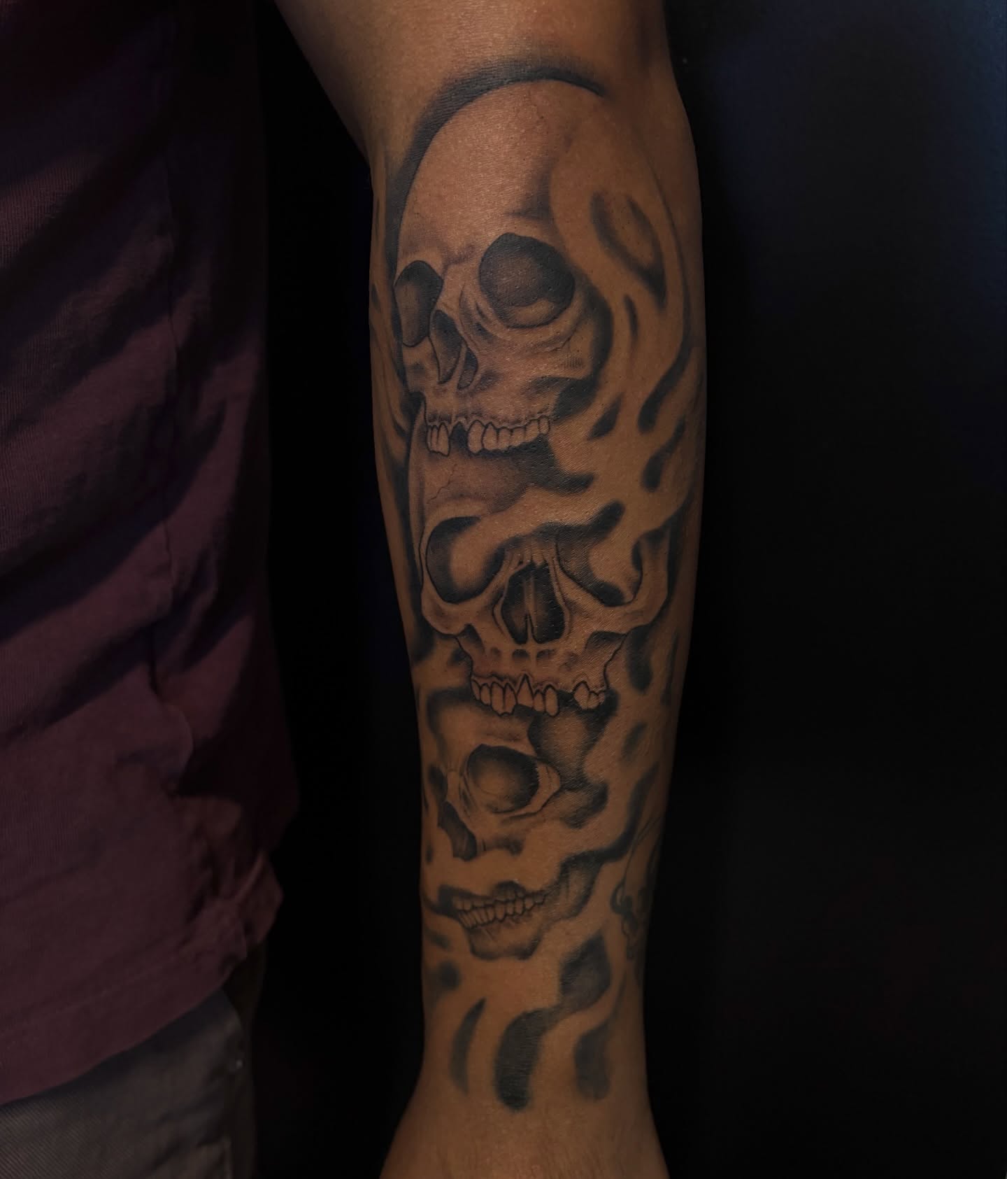 Skulls black and grey tattoo on the forearm by Elixabeth