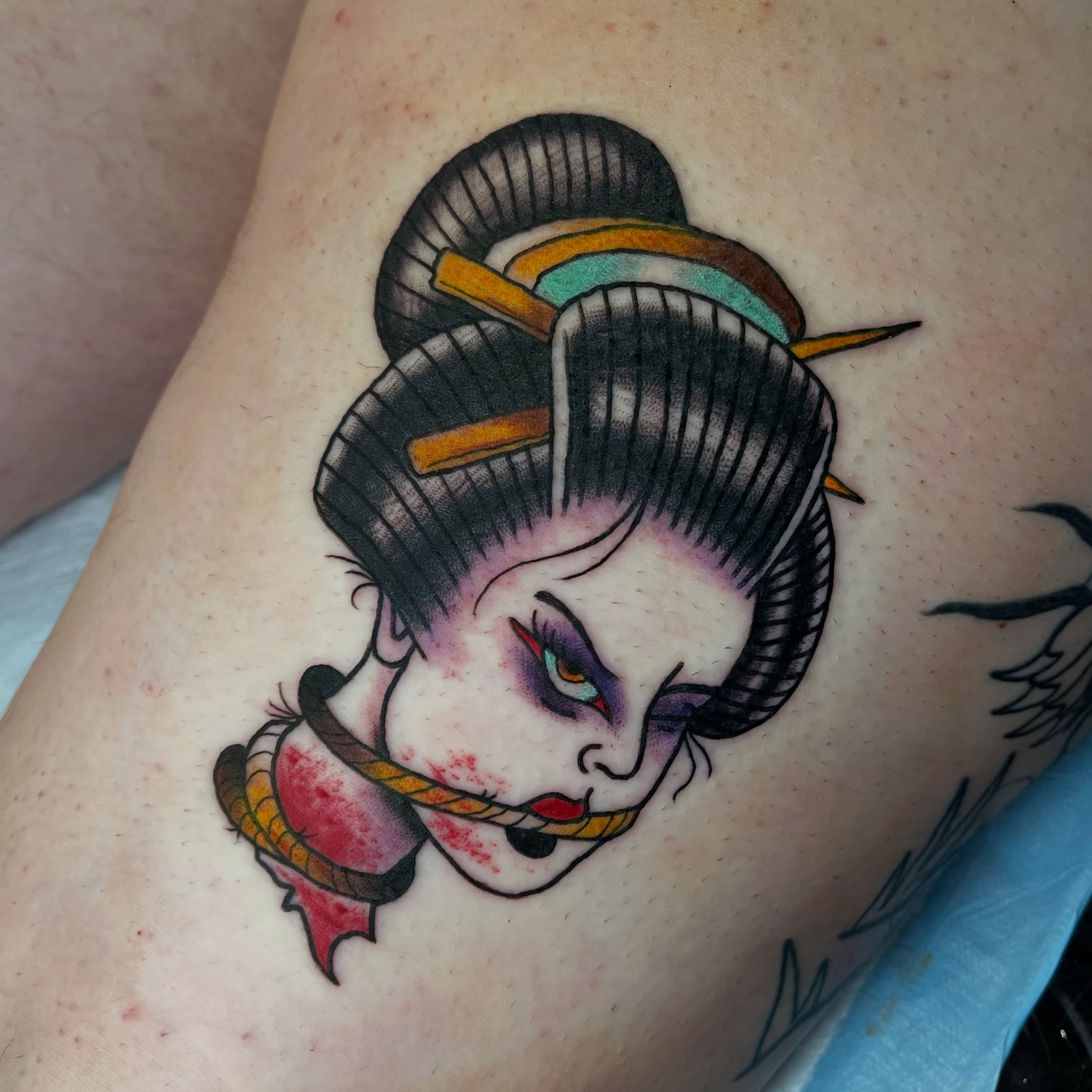 Geisha American traditional tattoo on the thigh by Josh Brownell