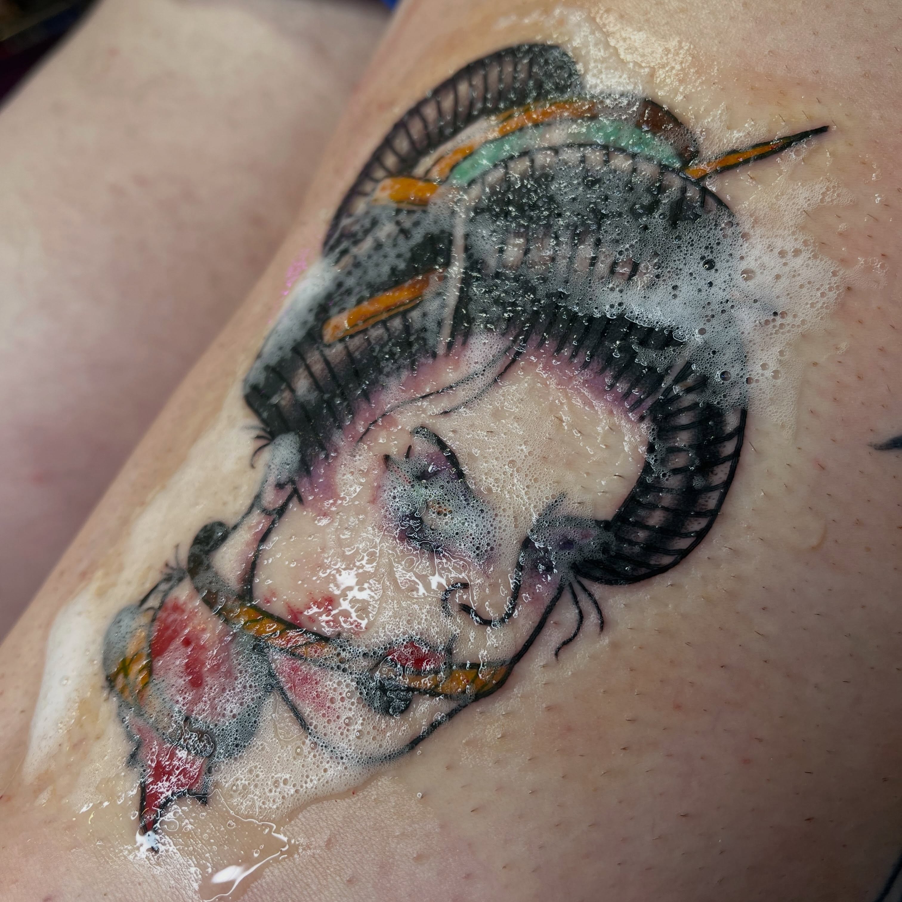 Woman with fish new school tattoo on the forearm by Josh Brownell