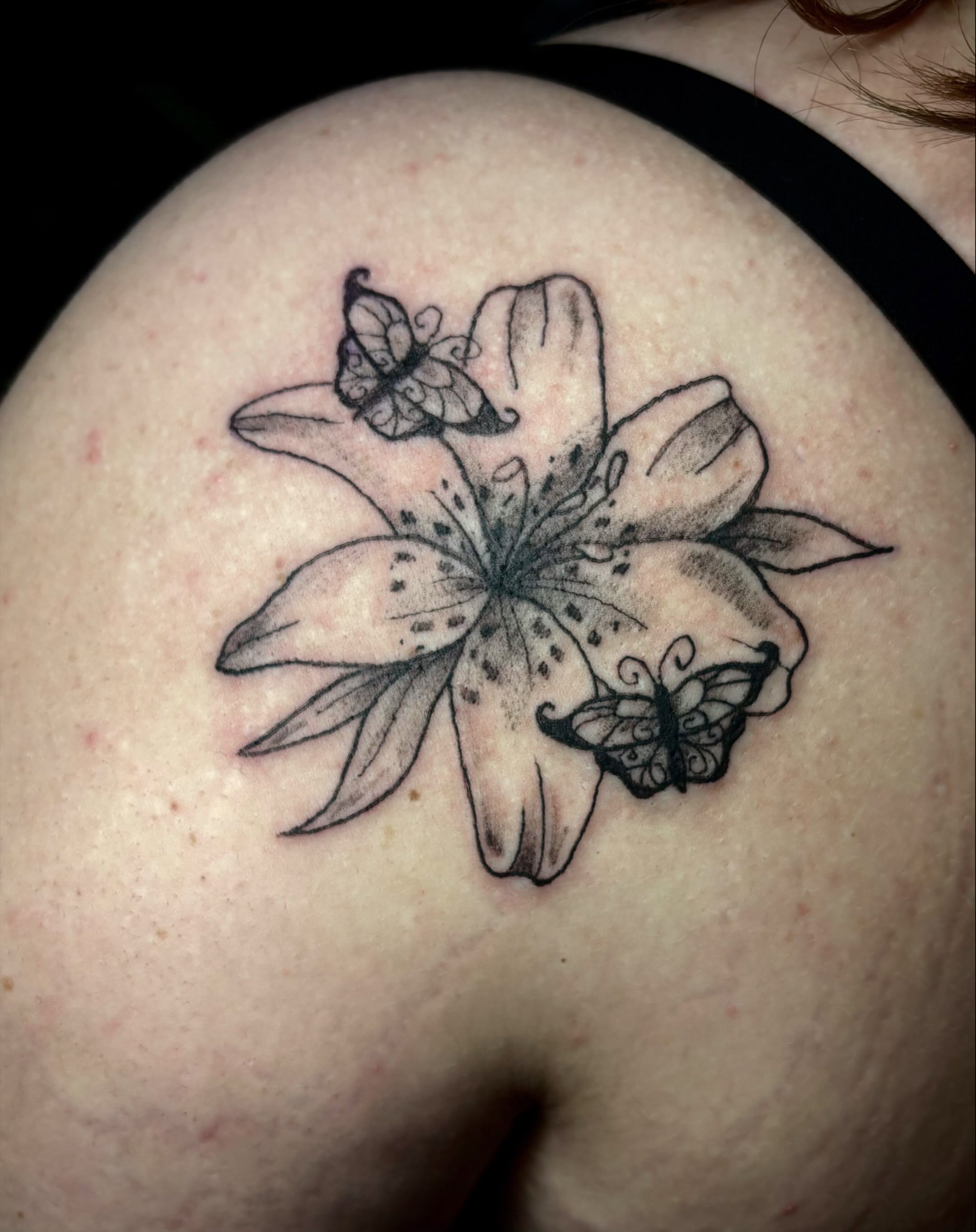 Lily and butterfly black and grey tattoo on the shoulder by ✮ ✄ star ✮ ✄