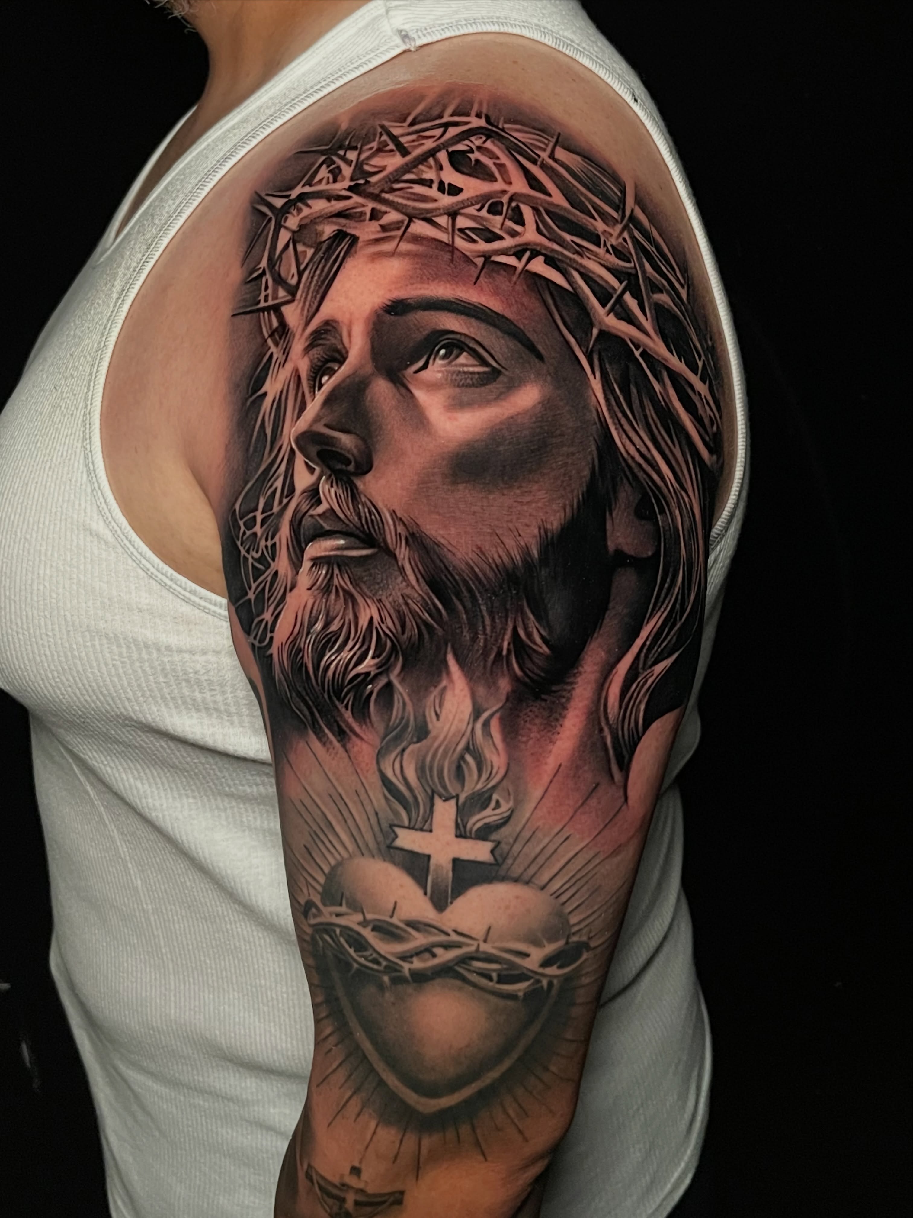 Jesus Christ realism tattoo on the shoulder by Michael Martinez
