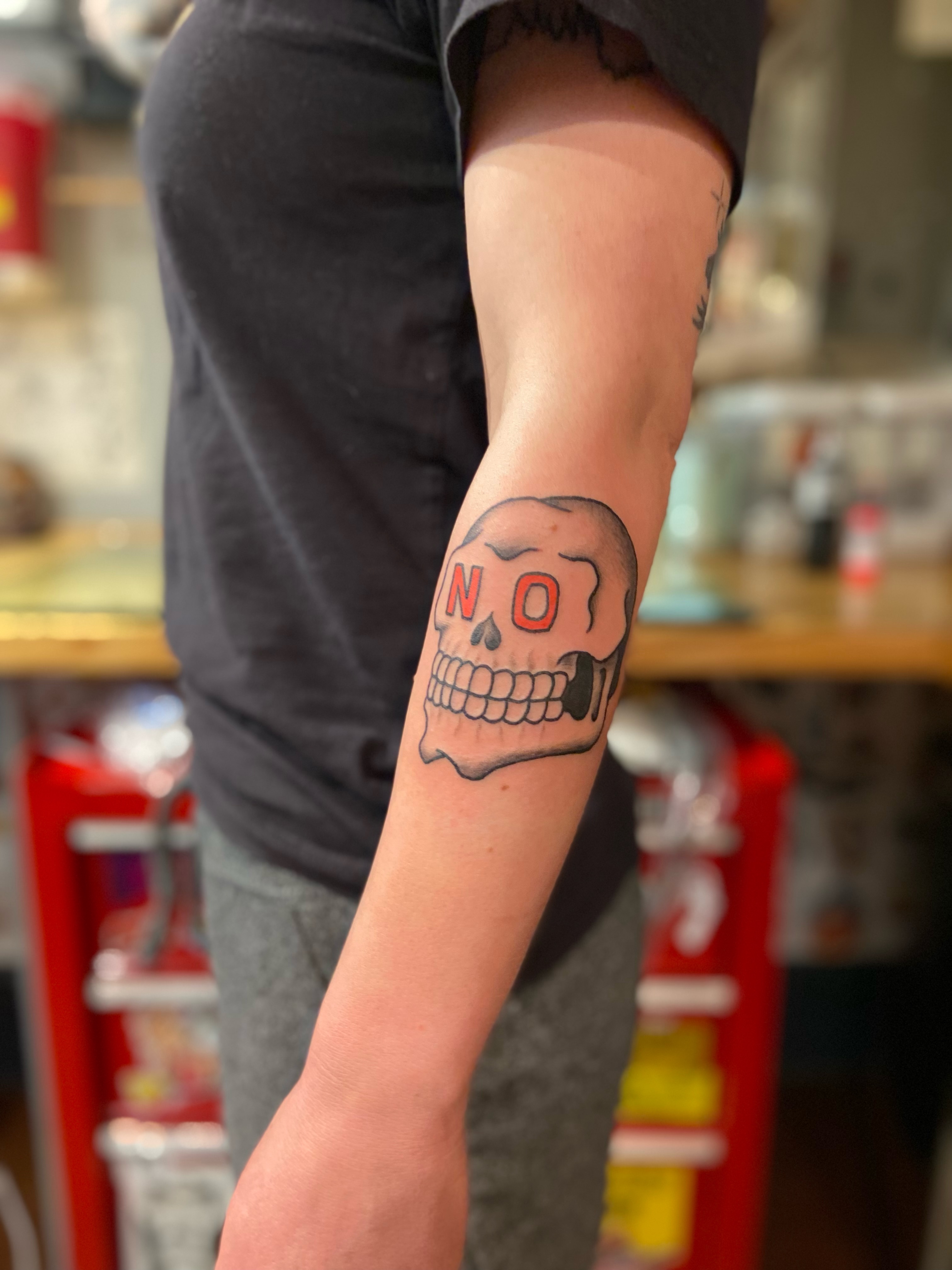 Skull American traditional tattoo on the forearm by Derek Krueger Portland Tattoo Artist, Portland, Oregon