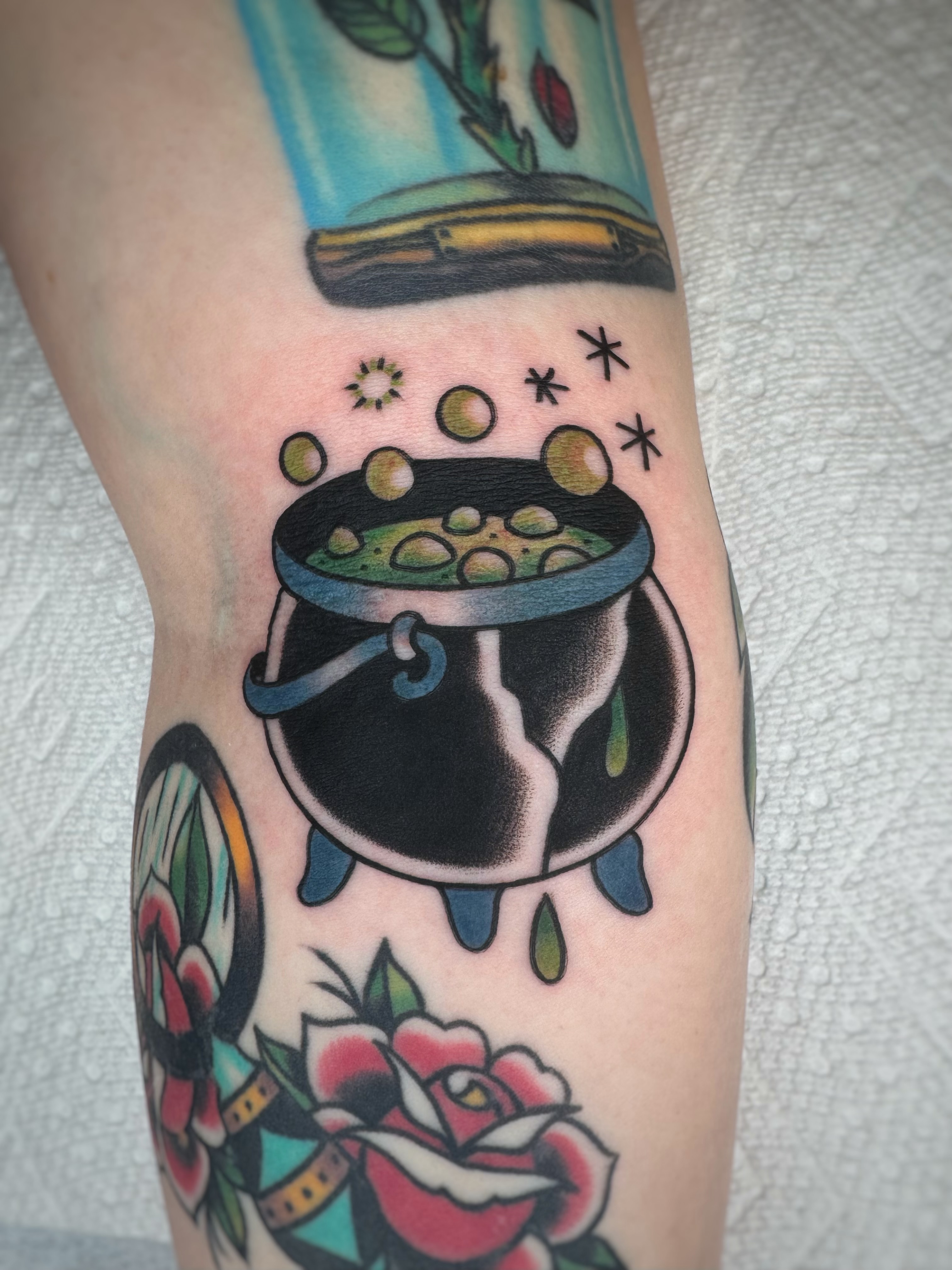 Cauldron with potion American traditional tattoo on the forearm by Cori James Tattoo Artist