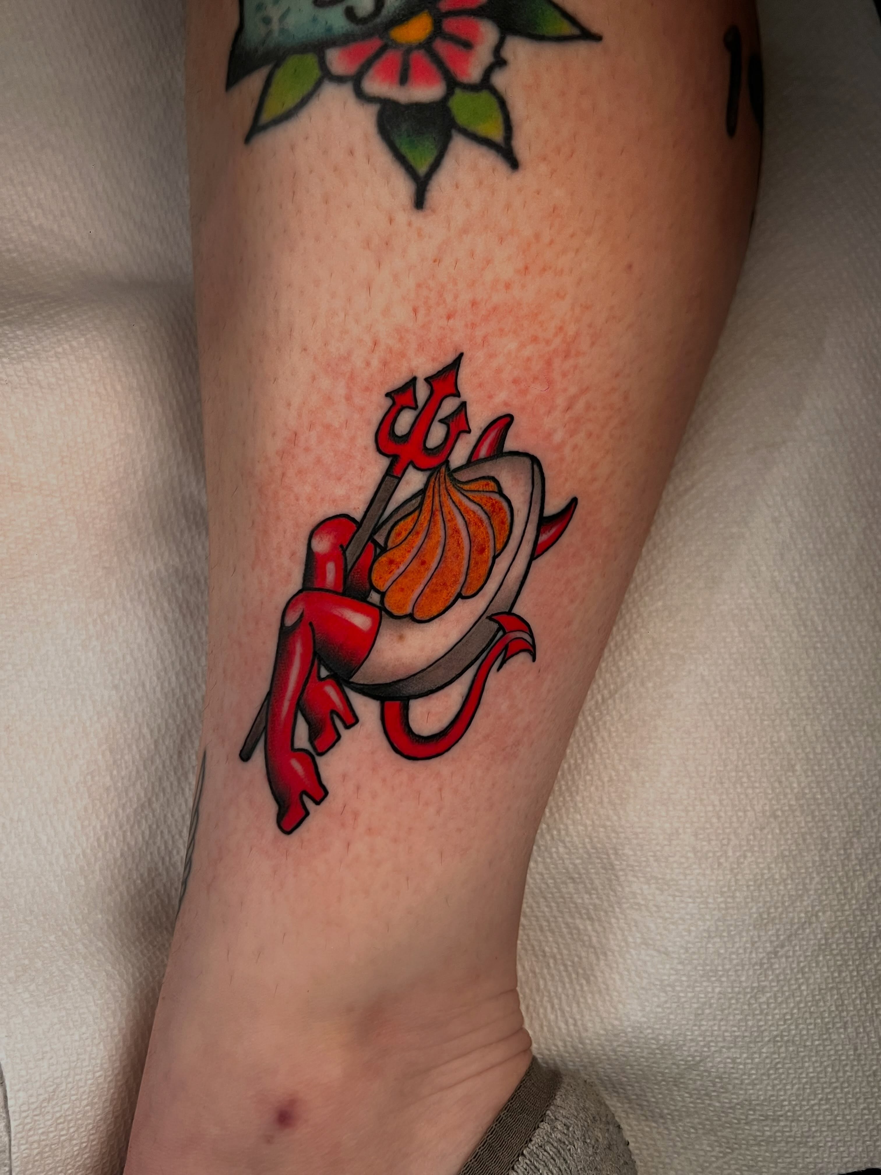 Red devil with pitchfork American traditional tattoo on the forearm by 𝙻𝚒𝚊 𝙹𝚎𝚙𝚙𝚎𝚜𝚎𝚗