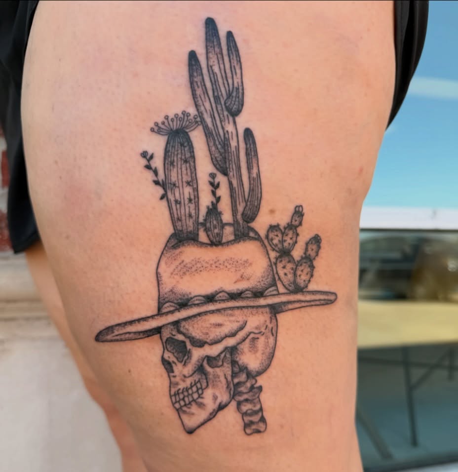 Skull with cacti dotwork tattoo on the thigh by Lexi Odam