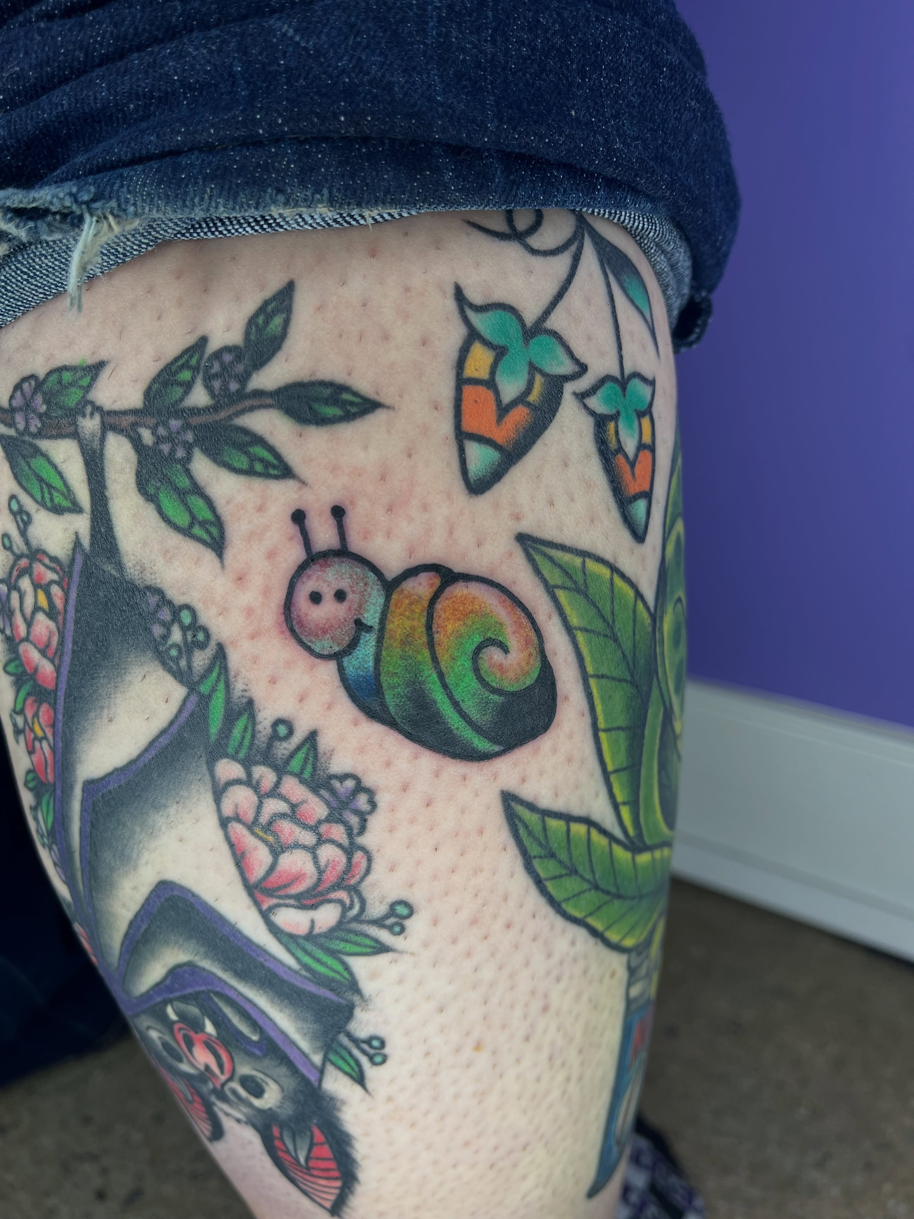 Snail and floral American traditional tattoo on the thigh by Autumn**🍓NOW BOOKING