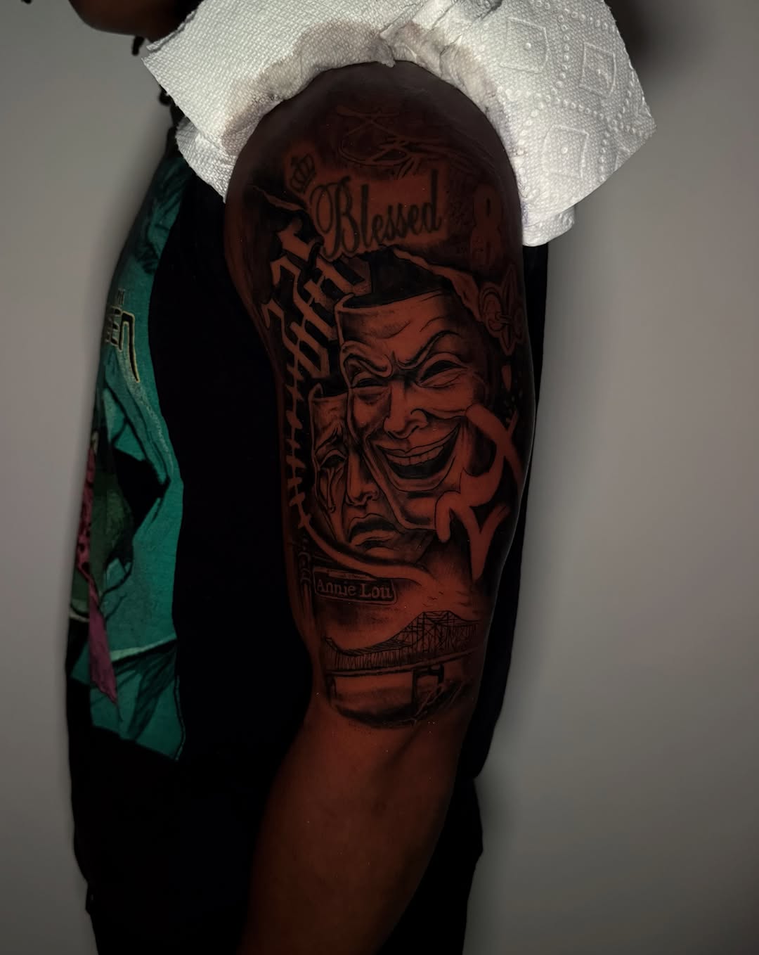 Mask and faces American traditional tattoo on the forearm by Asia Rene Tattoos👑