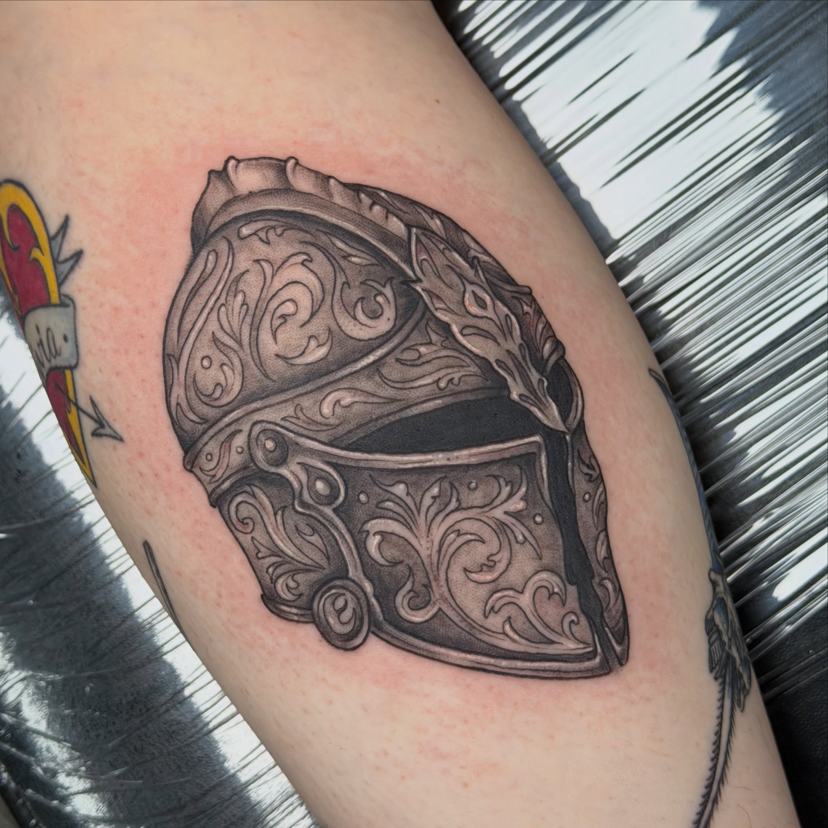 Helmet realism tattoo on the forearm by Olivia Norbert