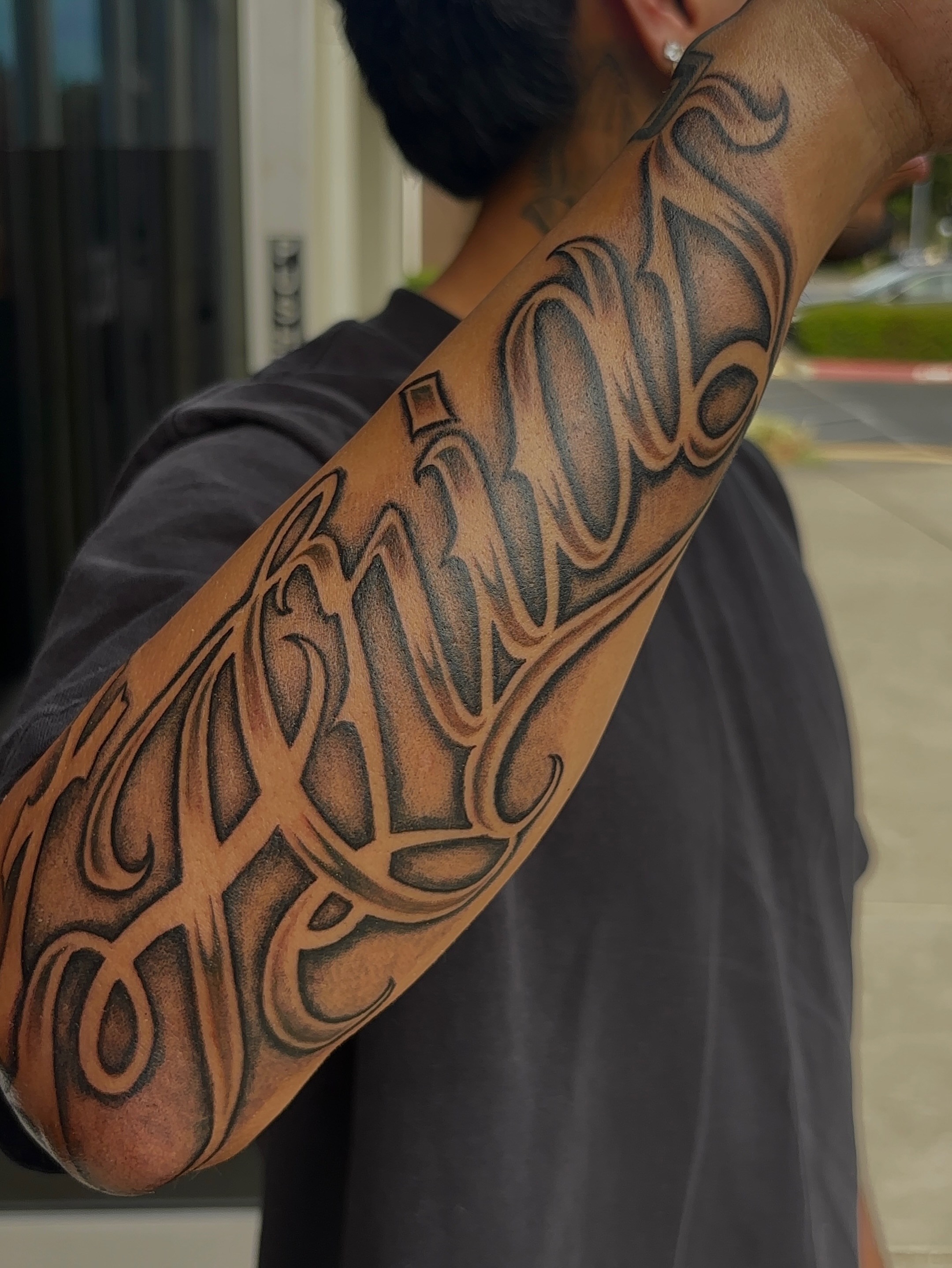 Script lettering lettering script tattoo on the forearm by Cristiano Ochoa, Elk Grove, California
