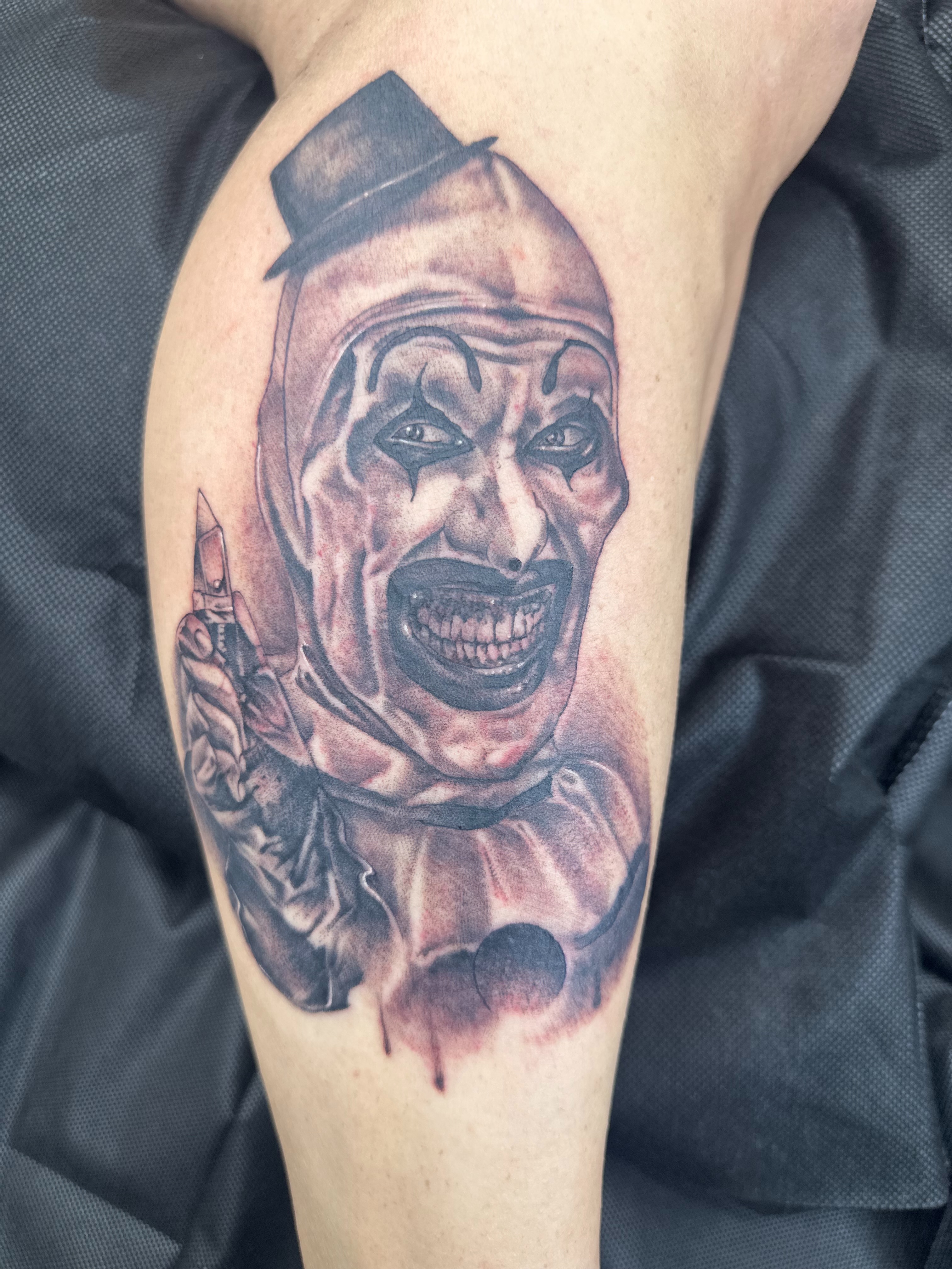 Clown realism tattoo on the forearm by Stevie O'Dell