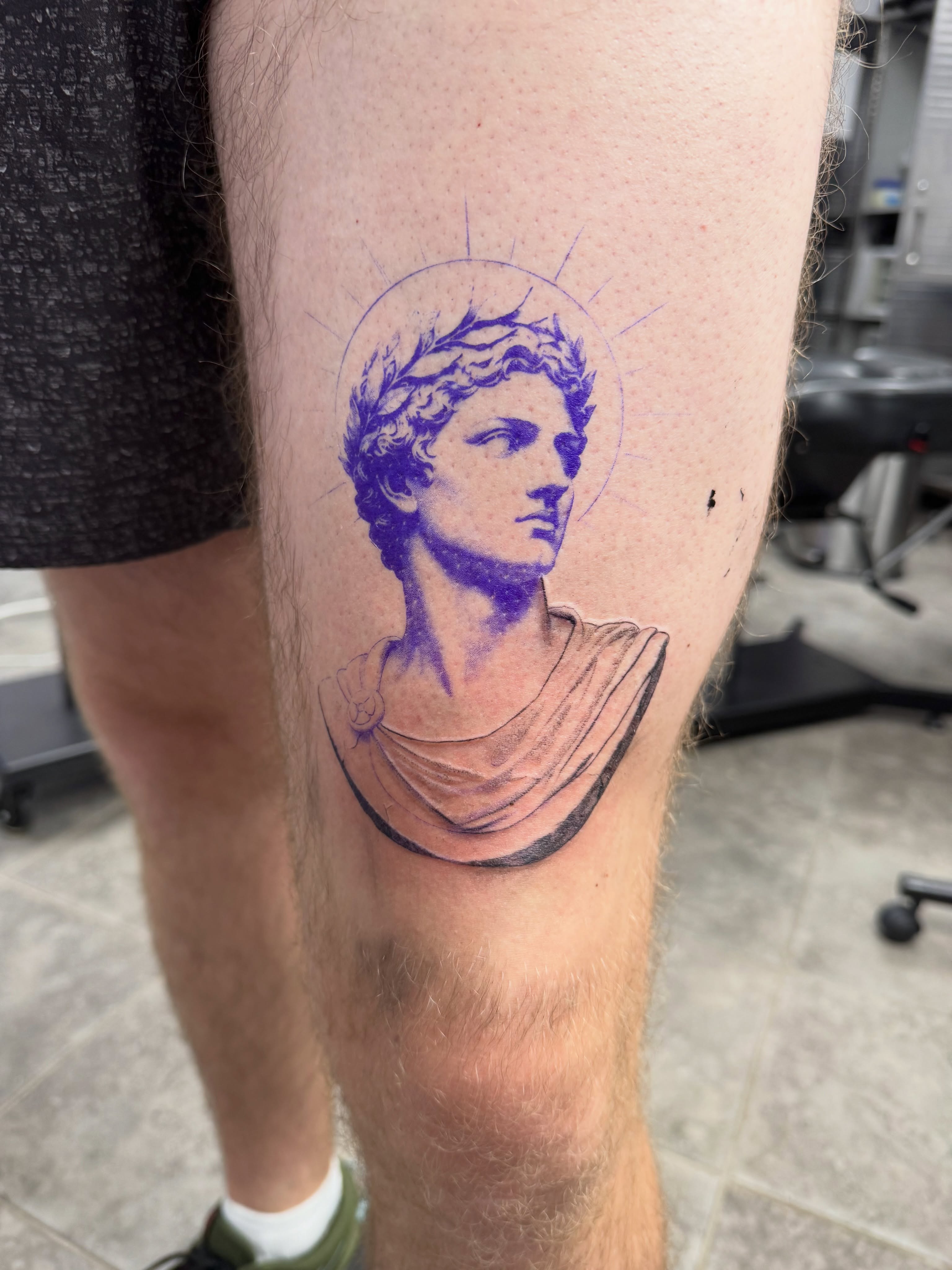 Statue head realism tattoo on the thigh by Juan Guzman