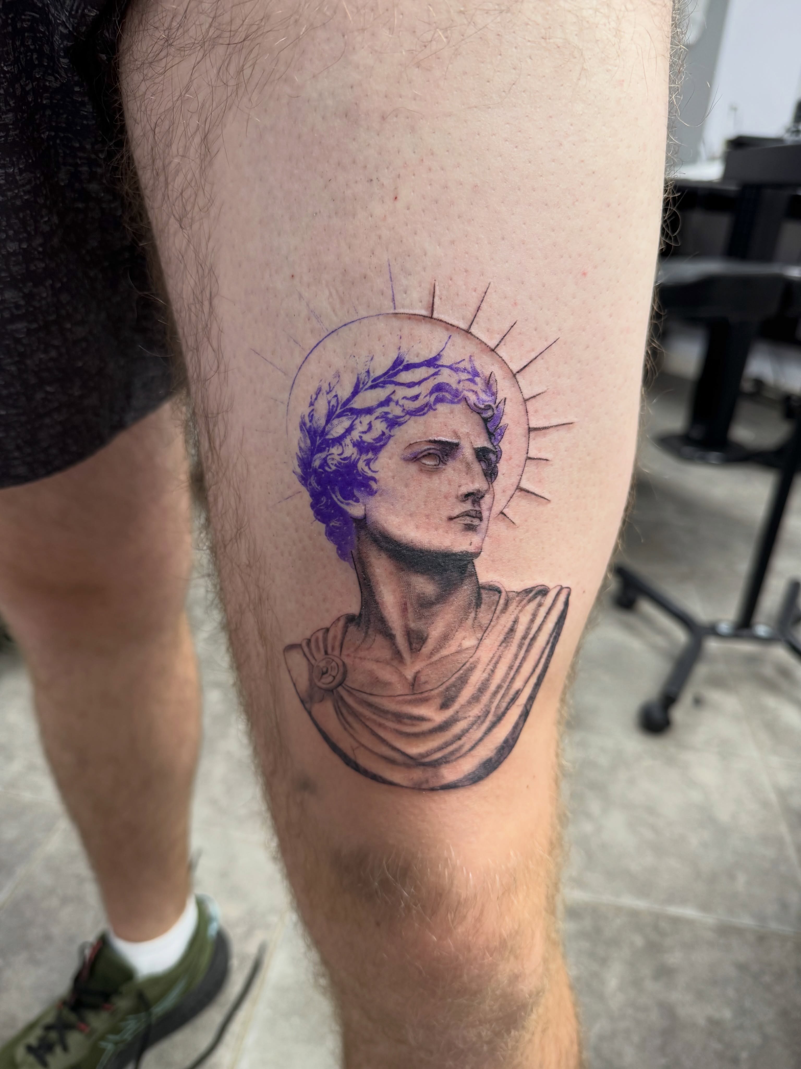 Statue head realism tattoo on the thigh by Juan Guzman
