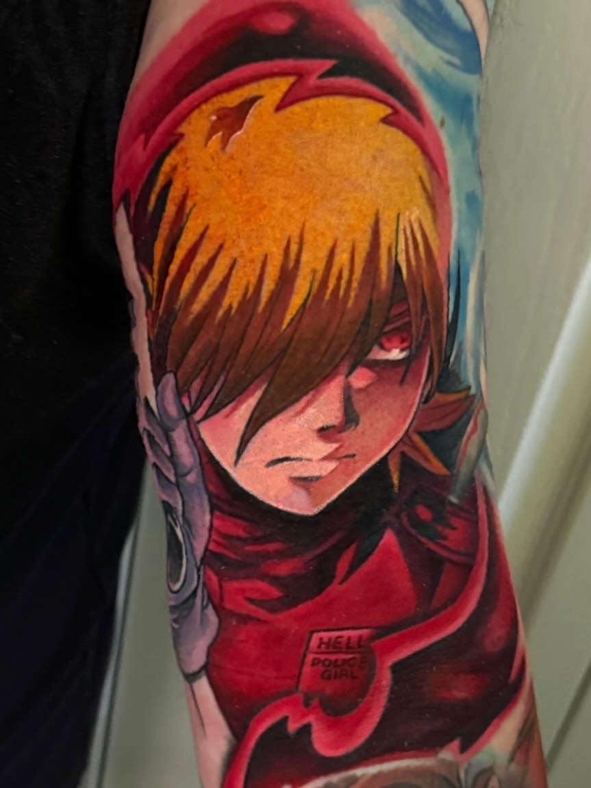 Anime character anime tattoo on the forearm by Mando Castro