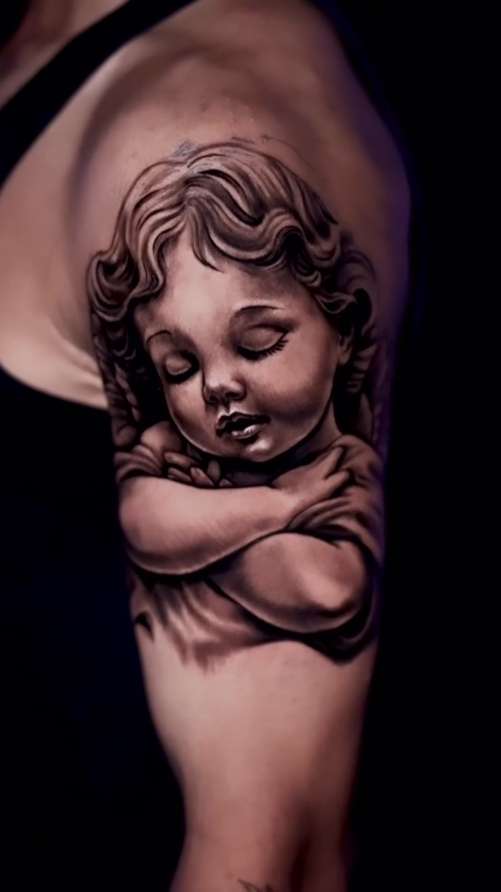 Cherub realism tattoo by Kiefer Fonseca