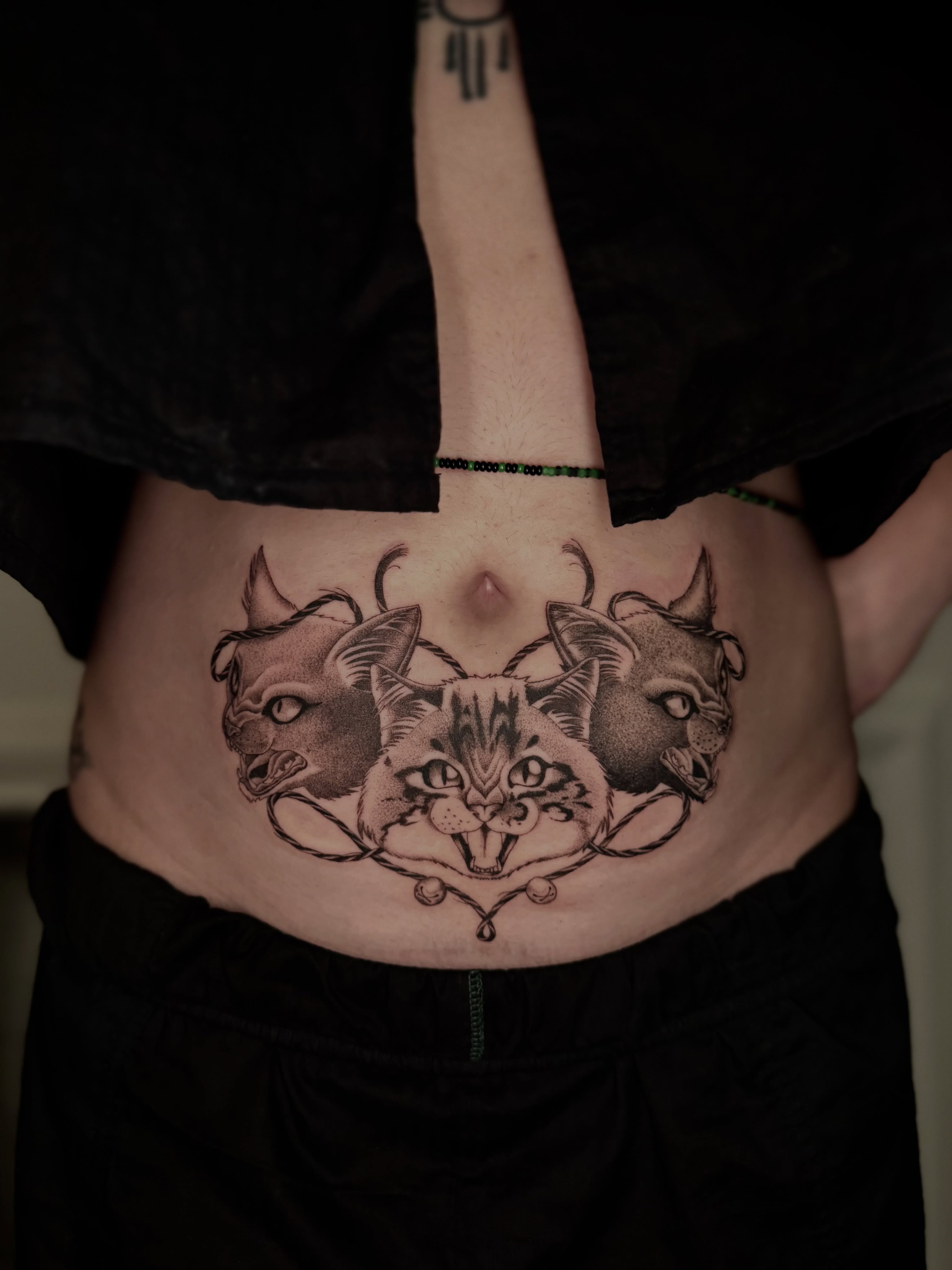 Cat faces black and grey tattoo on the torso by Virginia 🥀Neo Traditional