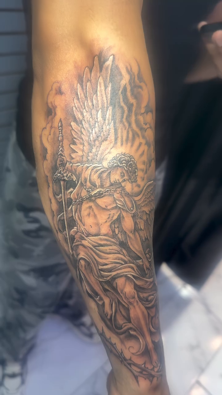 Angelic figure realism tattoo on the upper arm by Jose Onasis Disla, New York, New York