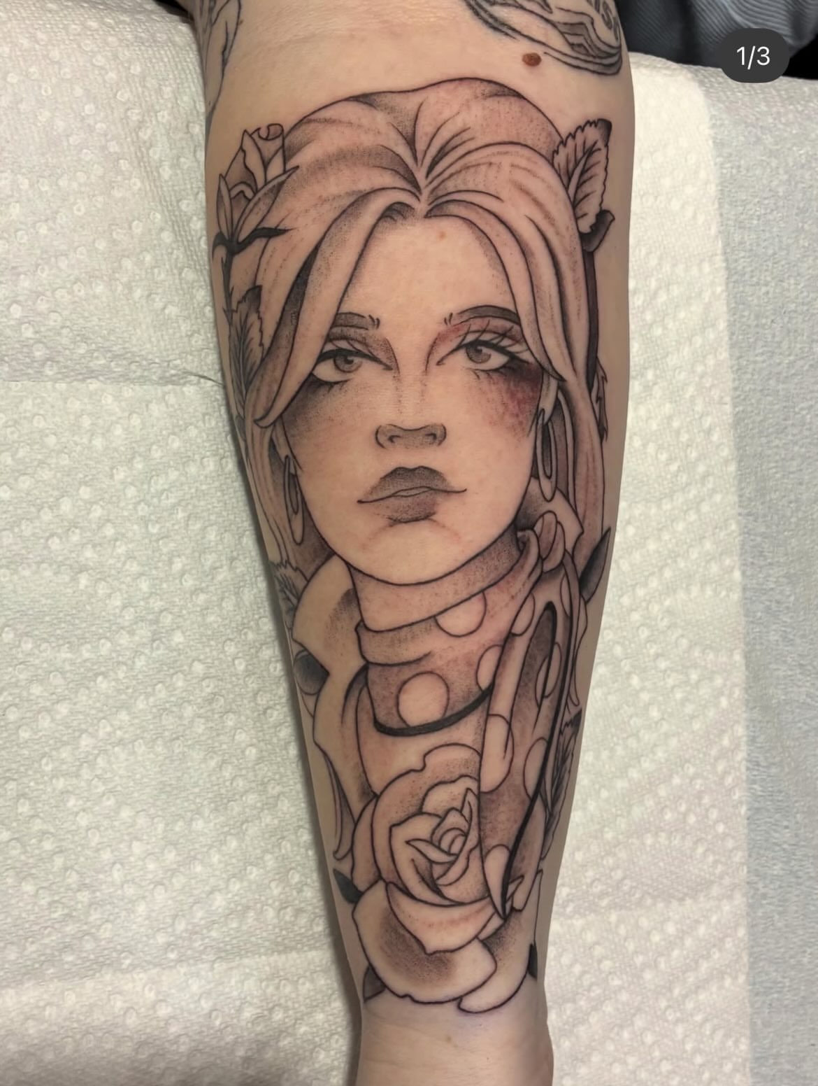 Woman's face realism tattoo on the forearm by Natalie Spuhler