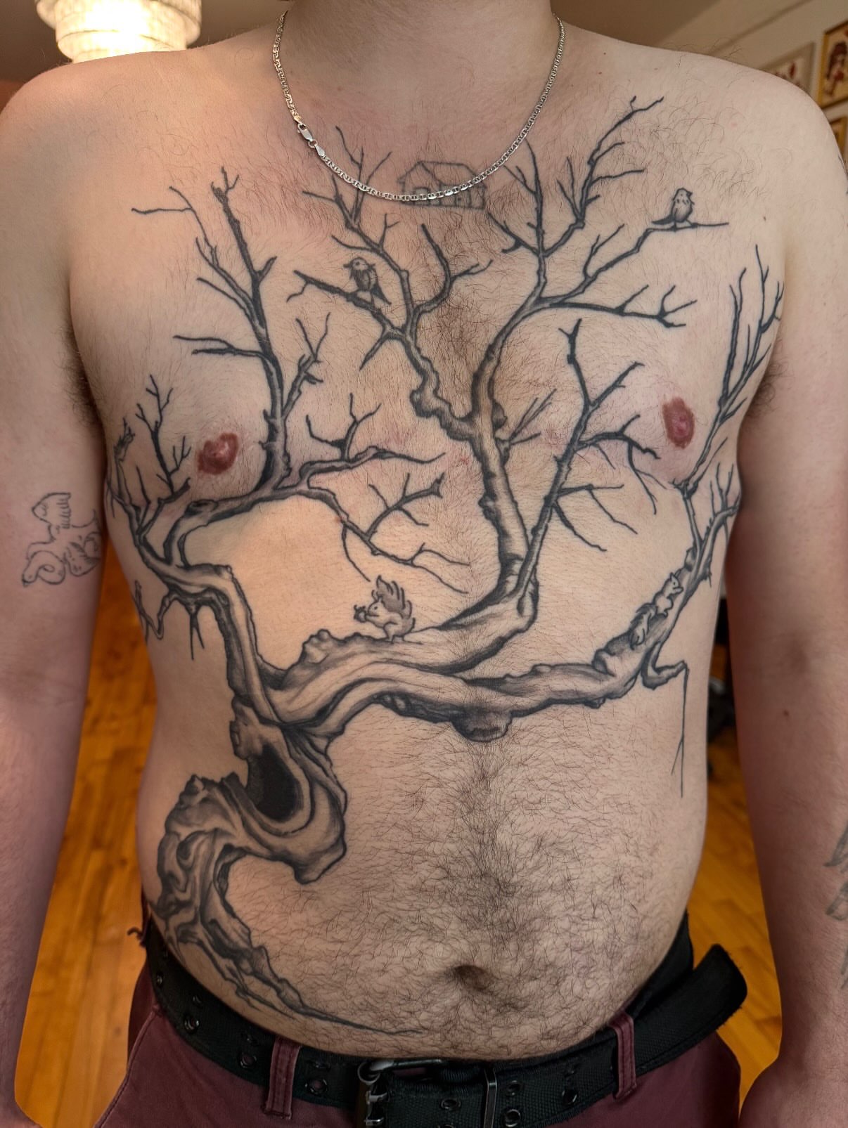 Tree black and grey tattoo on the chest by marlena borscheid