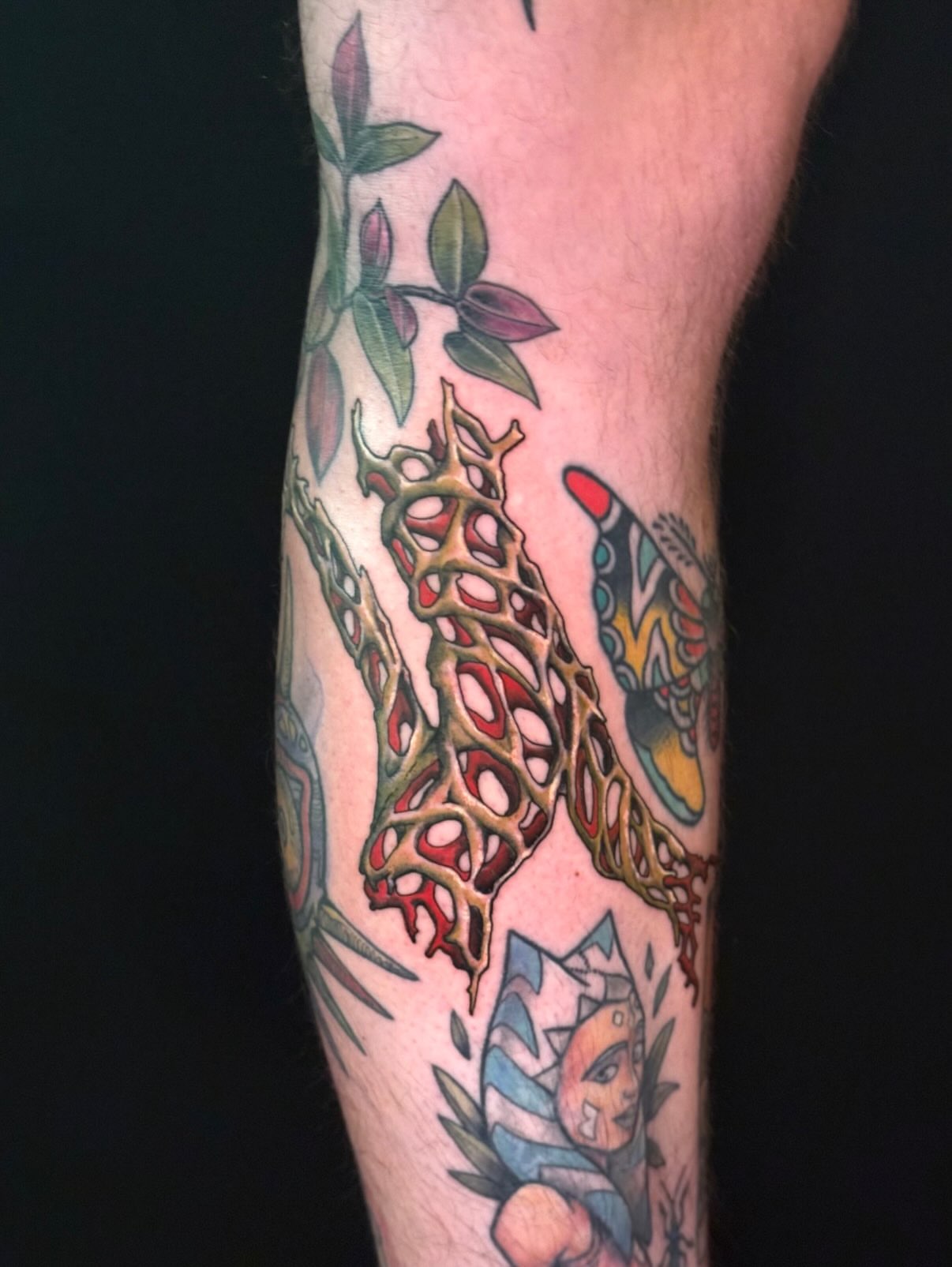 Spine and leaves new school tattoo on the forearm by marlena borscheid